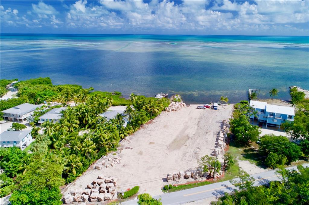 RARE SHOVEL READY ONE OF A KIND OCEAN FRONT DEVELOPMENT OPPORTUNITY in the heart of Islamorada. Build fifteen (15) market rate homes on this cleared ocean front parcel with dockage and its own private island. Tucked away off of the Old Highway offering privacy and peaceful living, this site is perfect for a private single family community or an income generating vacation rental community. Offering unparalleled access to world renowned offshore and back-country fishing grounds or the country's largest barrier reef this location appeals to everyone. Overlooking Alligator Reef Lighthouse and close to the world famous Islamorada sandbar and all of the amenities that have made Islamorada a world class resort destination makes this location beyond compare.
