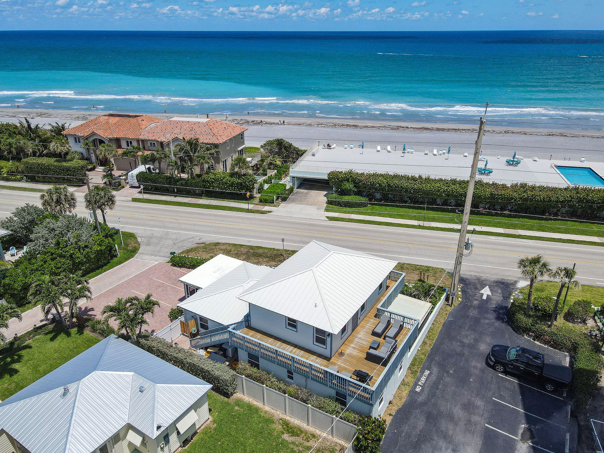 A truly unique property located directly across from the ocean in the heart of Juno Beach, one of South Florida's most charming and sought-after coastal communities. Enjoy deeded beach access just moments from your front door. The property is currently configured as two fully independent residences: a 3-bedroom, 2.5-bath main home featuring an expansive upstairs primary suite with ocean views and a private balcony, and a separate 1-bedroom, 1-bath apartment. Situated in a town known for its pristine beaches, walkable seaside lifestyle, and laid-back atmosphere, this property offers endless potential. It's an ideal site for a new luxury estate or a spacious private family retreat. Additional features include city water and sewer, separate water meters (with one sewer main), individual electric meters, separate addresses and no HOA.