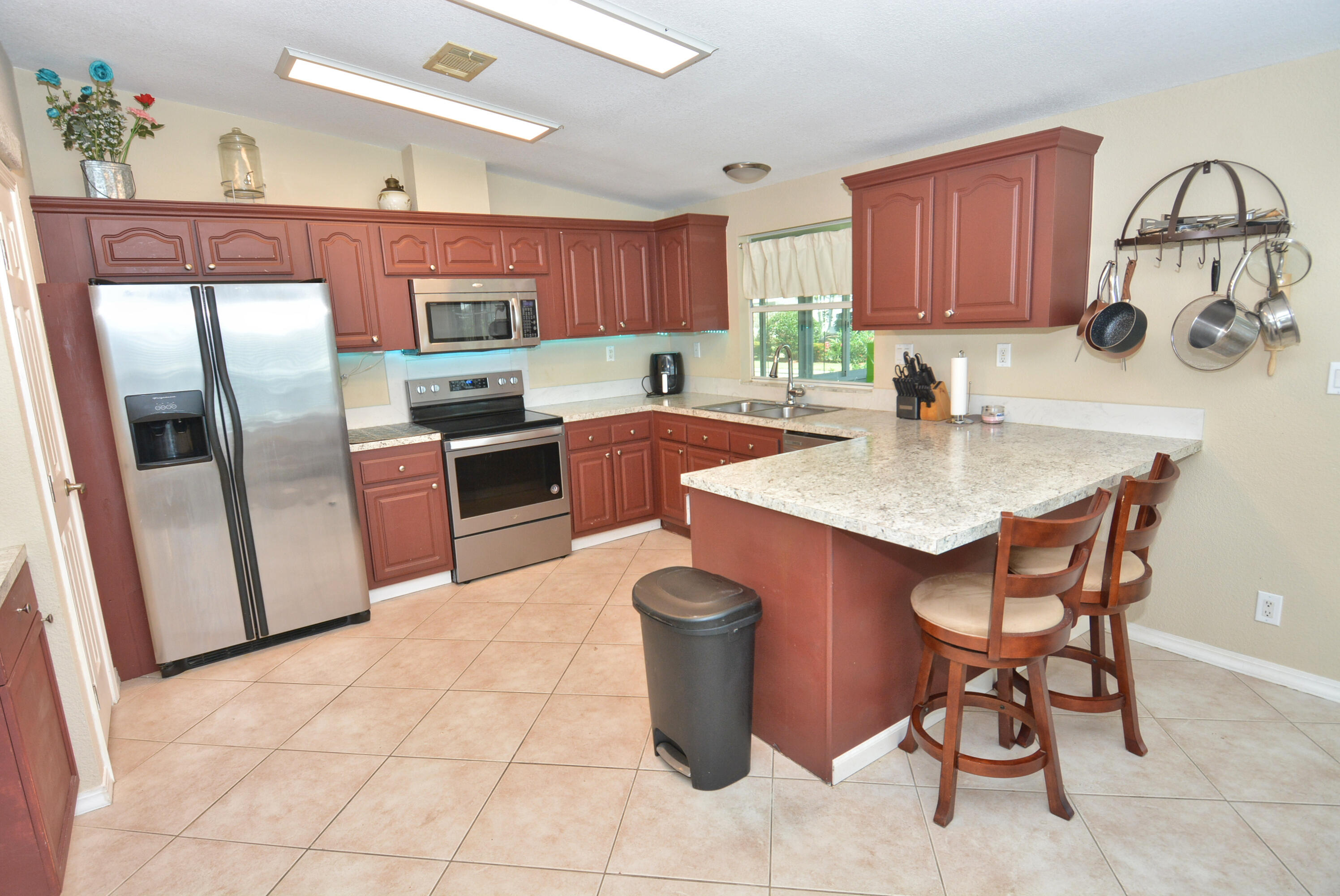 Home is rented however still on the market for sale.  THIS IS A GREAT INVESTOR OPPORTUNITY! Located in the 55+ community of Savanna Club, just 16 minutes from the beach, this 3 bedroom, 2 bath home with a 2-car garage and enclosed lanai offers great potential. Features include real windows, stainless steel appliances, and a roof only 3 years old. The home does need some work, but the price reflects the opportunity to create your own Florida paradise. Land lease property.