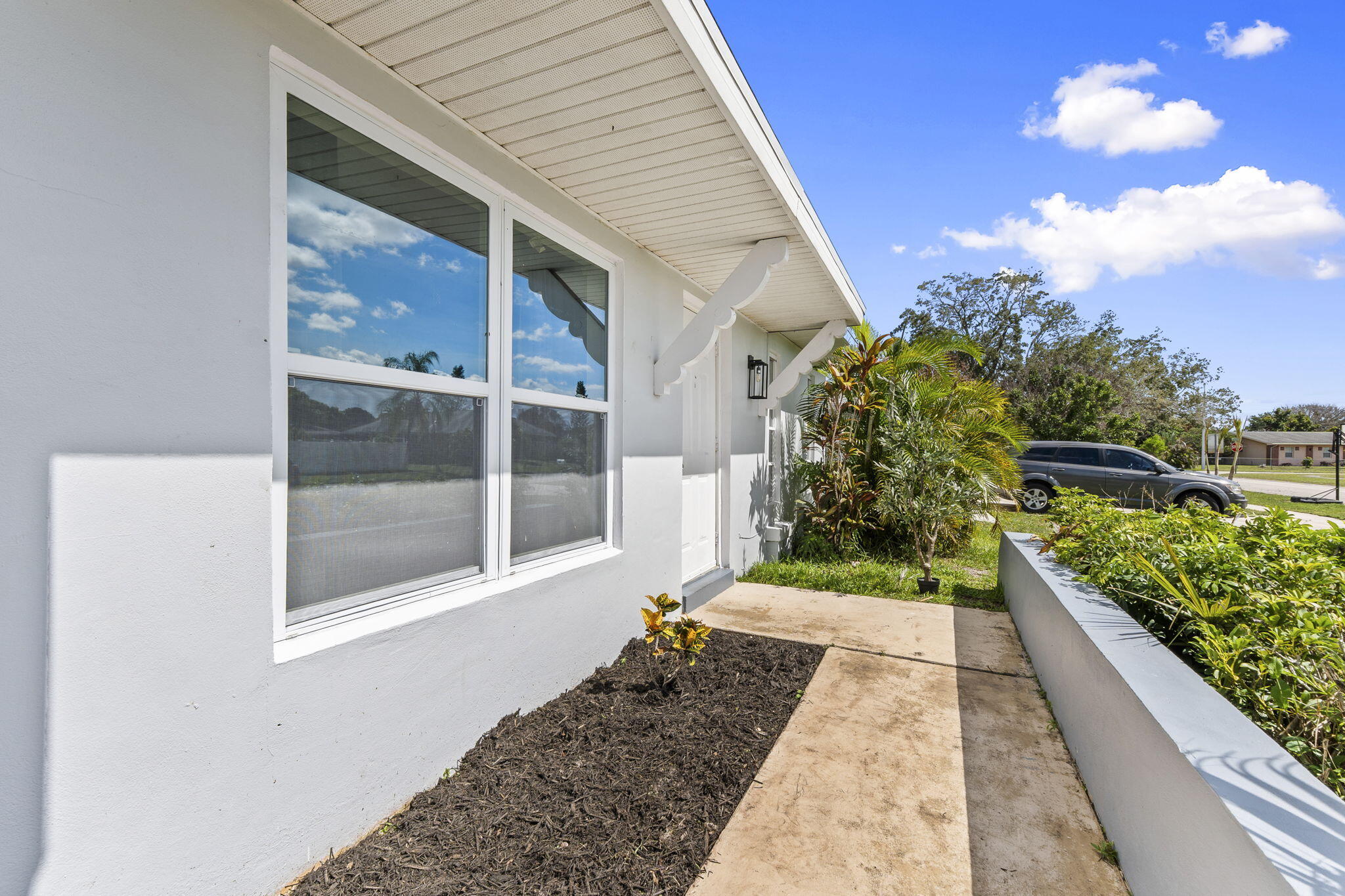 Whether you're a first-time homebuyer or an investor looking to expand your portfolio, this charming concrete block home is full of potential! Enjoy peace of mind with a 2022 roof, public water and sewer, and no deed restrictions. Inside, you'll find updated showers and vanities, while outside the fully fenced backyard offers plenty of space for pets, play, or even a future pool. Relax year-round on the screened porch and make this affordable property your own.