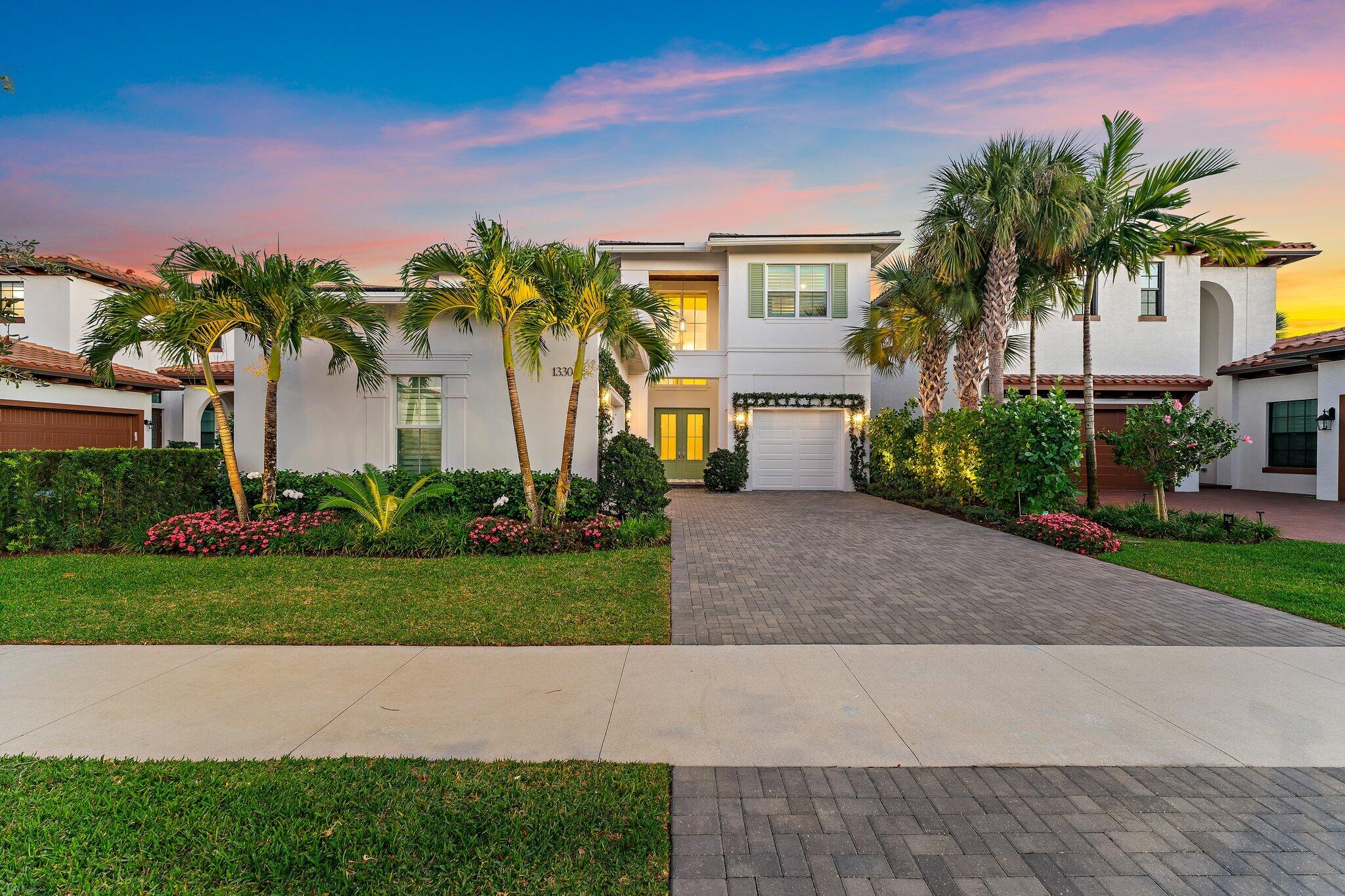 PERFECTION.  A rare opportunity to own a 2024 custom-designed Modern residence in Sold-Out Alton - offering a truly unmatched combination of scale, location and view.  It is exceptionally rare to find new construction east of I-95 with SIX en-suite bedrooms in a quiet, highly convenient neighborhood, particularly at this level of finish.  Among currently available homes, there are no true comparables that offer this combination of size, design and turnkey condition. Set on one of the community's most desirable homesites, the property features a expansive lake + preserve views and coveted South exposure, offering privacy rarely found.  Thoughtfully designed and fully customized, this grand residence includes a private office/den and a generous  enclosed loft or recreation room, creating ideal flexibility for modern living.  The true chef's kitchen is built for serious cooking and entertaining, featuring Signature Kitchen Suite (SKS) and Sub-Zero appliances, four ovens, two dishwashers and a spacious walk-in pantry. The finely curated interiors were done in collaboration with an award-winning design firm featured in publications such as Florida Design and Luxe Interiors & Design, resulting in a cohesive, elevated aesthetic throughout. Beyond extensive builder upgrades, the home has been comprehensively enhanced post-construction, including: • Whole-home smart technology and low-voltage integration • Motorized window treatments • Custom millwork and built-ins throughout • Fully upgraded lighting, fixtures, and switches • Significant additional electrical infrastructure The primary suite offers a private retreat with an expansive wardrobe room and spa-like bath, while each guest suite is generously sized with walk-in closets and en-suite baths. Outdoor living is equally exceptional, with a resort-style pool and spa overlooking wide, tranquil lake views. A fully equipped custom outdoor kitchen and dining area—complete with wine refrigeration—creates an ideal setting for entertaining. Dual laundry rooms (upstairs and downstairs) provide added convenience .  Ideally located along the Donald Ross corridor, this home is within walking distance to The Benjamin School and Meyer Preparatory School, and just a short drive to several of the area's other top schools, as well as beaches, shopping, dining, and cultural attractions. A truly turnkey, design-forward residence where rarity, location, and execution converge—offering a level of quality and convenience whose replacement cost and complexity would far exceed its list price and immediate availability.