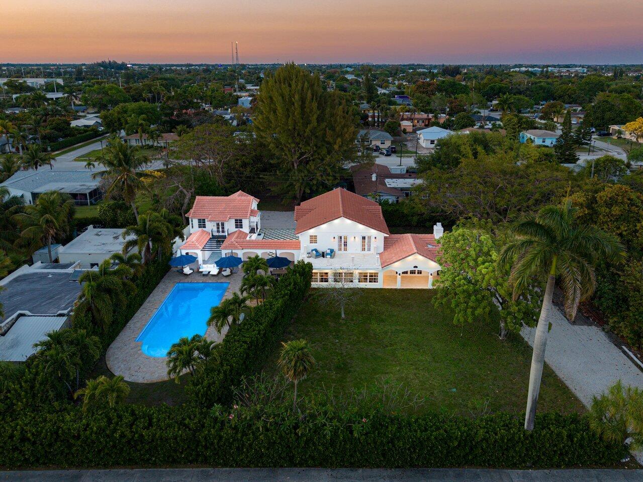 Truly rare opportunity to own your own private compound with no HOA on an expansive lot with additional buildable space and potential to subdivide. The main home was newly built in 2023, complemented by a beautifully updated guest house (2021) perfect for rental income or multi-generational living. Enjoy a huge resort-style pool, oversized recreation room, and endless space to create your dream outdoor retreat—tennis, pickleball, gardens, or entertaining under the stars. Two separate entrances offer exceptional flexibility and privacy. Ideally located near I-95, the beach, and vibrant downtown Delray and Boynton, this is a one-of-a-kind offering for end users and investors alike.