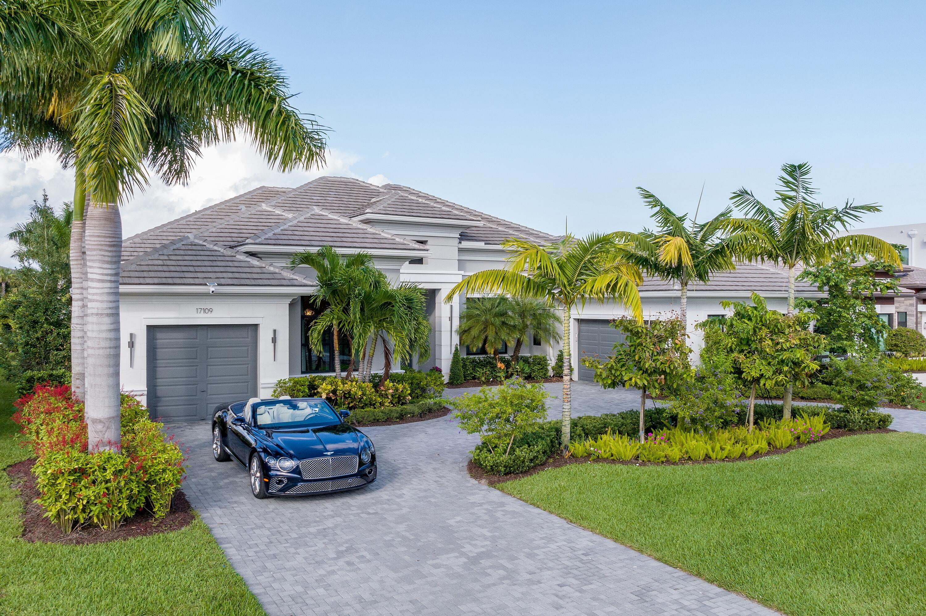 17109 Brulee Breeze Way. As if celebrating the good life inside one of South Florida's most celebrated luxury communities isn't already enticing enough, this coveted model at prestigious Boca Bridges further captures the imagination with design that's both striking and inviting. The thoughtfully conceived 5,980-square-foot layout, one of just a handful of Belvedere Transitional models, dazzles with waterfront splendor, clean lines, custom details and brilliantly rendered spaces. Each curated room complements the next with a thread of sophistication and comfort, starting with a spacious great room that boasts soaring ceilings and a decorative fireplace. The four-bedroom layout (with five full baths and one-half bath) also features a family room, formal dining room, media room, club room... and wet bar, as well as a three-car garage. The spacious primary suite soars with a sitting area, two large walk-in closets and an oversized bath. 

The heart and soul of the home is its open gourmet kitchen with state-of-the-art appliances, custom-crafted cabinetry and a statement-making island that overlooks the family room. It's only appropriate that the space opens directly to an outdoor oasis that, just like the kitchen/family room, is designed with entertaining in mind. The massive patio area, entirely screened in, includes a built-in summer kitchen and Carrera marble deck. There's even a table and benches woven into the pool design, perfect for refreshing beverage or brunch on a sunny afternoon. 

Beyond their own backyard, residents of Boca Bridges have access to a myriad of amenities befitting such a dynamic development. The centerpiece of activity is a 27,000-square-foot clubhouse where neighbors can socialize and enjoy the good life, as well as gourmet meals inside the community's own restaurant. For active residents, Boca Bridges boasts a fitness studio with cardio and strength-training equipment, yoga classes, an indoor basketball court, six clay (and one asphalt) tennis courts, and four pickleball courts. There's even a splash water park for kids adjacent to the main pool, which features an outdoor bar area.