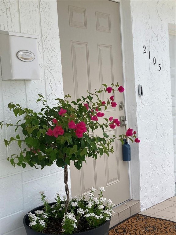 Beautiful.  Modern, open floor plan.  Move-in ready. Challenger Model. Brand new hurricane impact windows (2023), new hurricane impact doors (2023), new hurricane impact garage door (2023), new air conditioning system (2023), new tankless hot water heater (2023), brand new flooring (2023), new kitchen cabinets (2023).  Updated plumbing and electrical. City Approved Permits.  Alarm system and exterior cameras do not convey.  Minutes to beaches, shopping, restaurants.  Community has swimming pool, hot tub, sauna, billiards, gym.  Free golf course. Low HOA fee.  Listing agent has ownership interest.  All information deemed reliable but subject to errors, omissions and changes without notice. House may convey with furnishings.