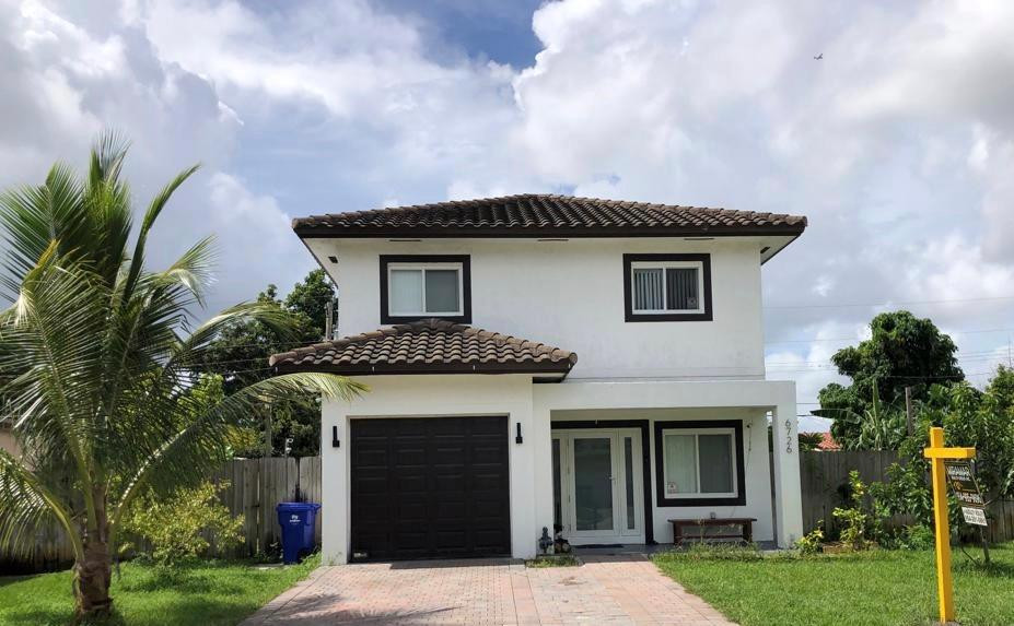A MUST SEE!Stunningly beautiful Mediterranean-style 2-story home in the heart of peaceful & scenic Miramar. No HOA. Property still feels brand new as family only fully moved in 4 mths ago. Main bedroom is spacious with large his & her closets & extended balcony that provides a panoramic view for miles around! Gorgeous master bathroom with separate tub & shower. Stainless steel appliances. Recess lighting inside & out. Impact windows & doors. Garage doubles as a multi-functional space for the culinary or artistic individual. Backyard is simply amazing!  Exotic fruit trees in the front yard & dots the backyard, which is large enough to install a pool, trailer or just about anything your heart desires. Once you see this property, you won't want anything else. Schedule your showing today!