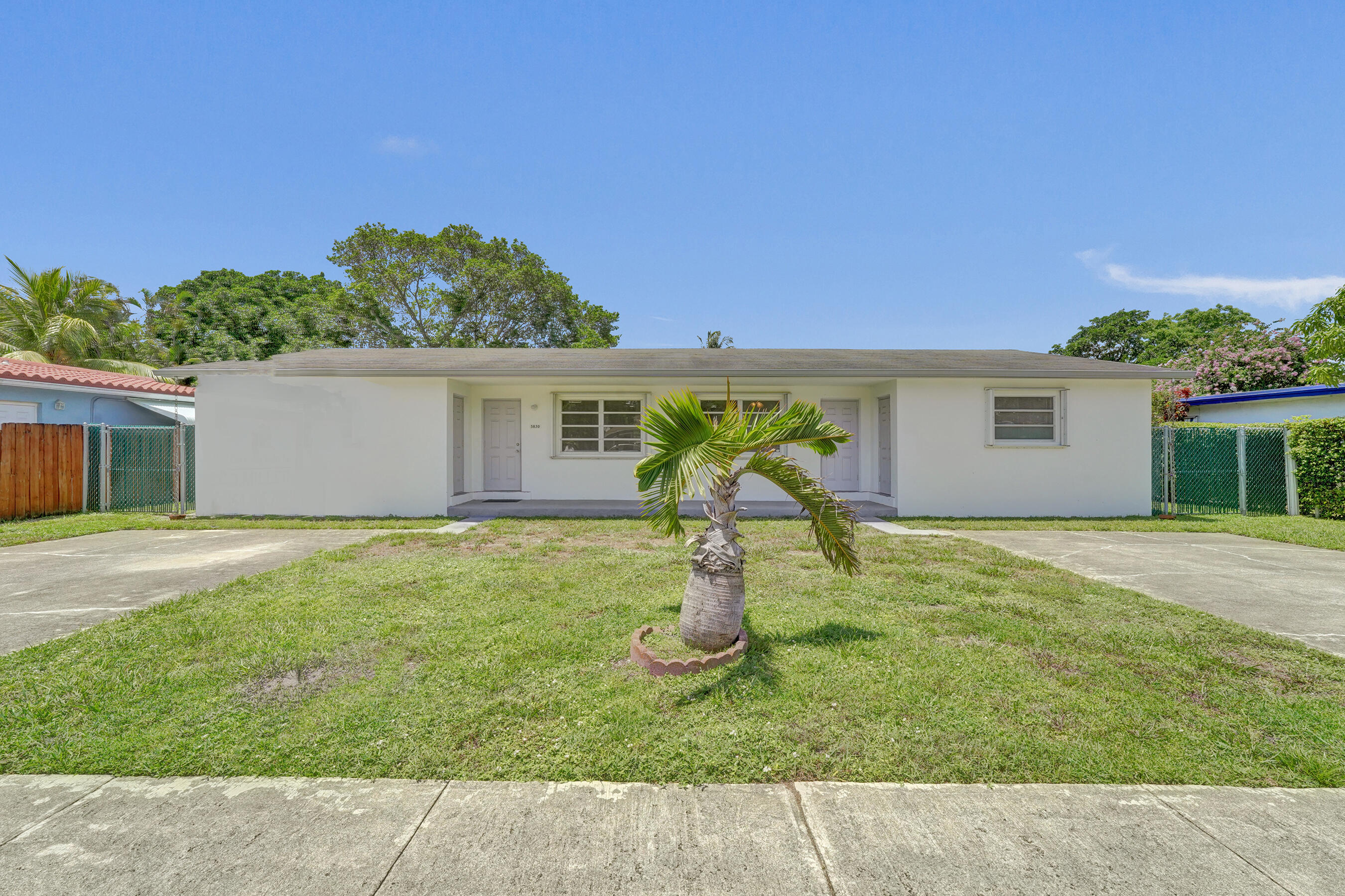 Excellent investment opportunity! Well-maintained duplex featuring two spacious 2bed/2ba residences, each with its own private entrances, separate driveway, updated kitchen, durable tile flooring, separate laundry/storage room. Separate electric and water meters provide added convenience.The oversized backward offers ample outdoor space. Neat, clean and move-in ready, located just west of St Rd 7 (441) on Garfield St. in a highly desirable rental area with easy access to all conveniences. Live in one side and let the other help pay your mortgage or add this income-producing property to your portfolio.  Opportunities like this don't last!