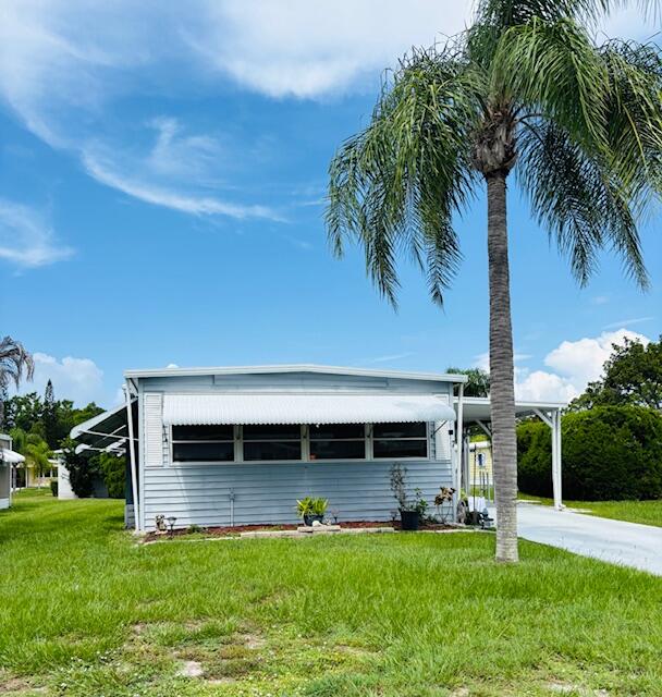 Welcome to this charming 2-bedroom, 2-bathroom mobile home nestled in Spanish Lakes Golf Village in Port St. Lucie, Florida. This single-story residence offers practical living space with straightforward comfort and convenience for those seeking a low-maintenance lifestyle. The two full bathrooms provide excellent functionality for daily living, while the two generously appointed bedrooms offer flexibility for personal needs. Located within the established Spanish Lakes Golf Village community, this property presents an accessible option for those looking to simplify their living arrangements without sacrificing essential amenities and comfort.