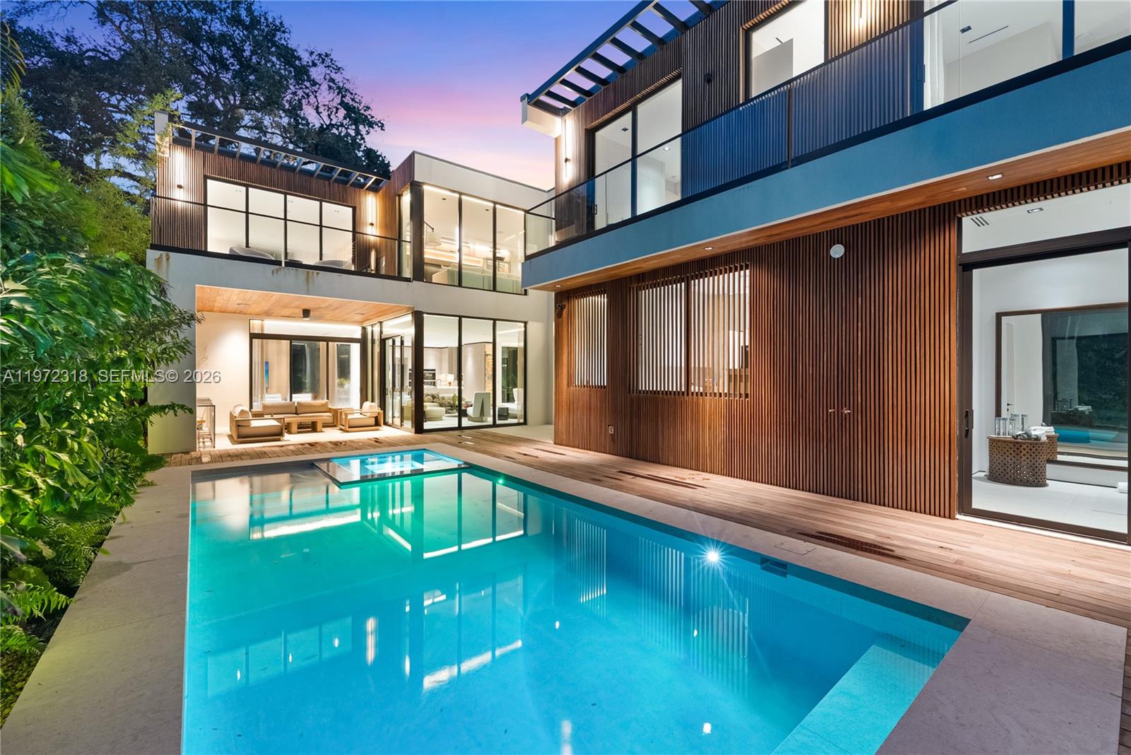 Introducing CASA GRANDE, a striking architectural statement set on a premier corner lot in the heart of Coconut Grove. Designed by Bernardo Paredes and developed by The Modd Group, this 7-bedroom, 7-bathroom modern estate seamlessly blends bold design with refined comfort and functionality.A dramatic double-height foyer and sculptural floating staircase set the tone for sophisticated interiors. Expansive living and dining areas flow into a state-of-the-art chef’s kitchen with premium appliances and an oversized walk-in pantry. The main level also features a custom family room, private office, full laundry room, two-car garage, and a versatile yoga suite/cabana with full bath.Upstairs offers five spacious ensuite bedrooms, including a luxurious primary suite, plus a second-floor lounge ideal for relaxing or movie nights.Designed for effortless indoor-outdoor living, the home opens to a covered terrace with summer kitchen, resort-style pool and spa, and lush tropical landscaping for ultimate privacy.Available turnkey furnished and move-in ready.