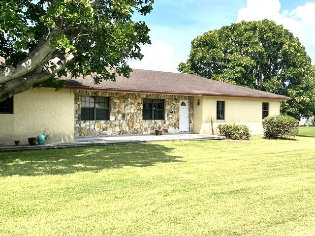 This 3-bedroom, 3-bath home is situated on approximately 0.66 acres in Canal Point. With over 2,600 square feet of living space, this property features an office ideal for working from home, a two-car garage, and a large, air-conditioned bonus room surrounded by windows, creating a bright and inviting sunroom-style retreat perfect for enjoying peaceful views year-round. The spacious layout provides plenty of room for large gatherings and everyday living, while the expansive yard offers endless possibilities for outdoor enjoyment. If boating and fishing are two of your hobbies, You'll appreciate being less than a mile from the public boat ramp, providing quick and easy access to beautiful Lake Okeechobee for world-class fishing, boating, and outdoor recreation.