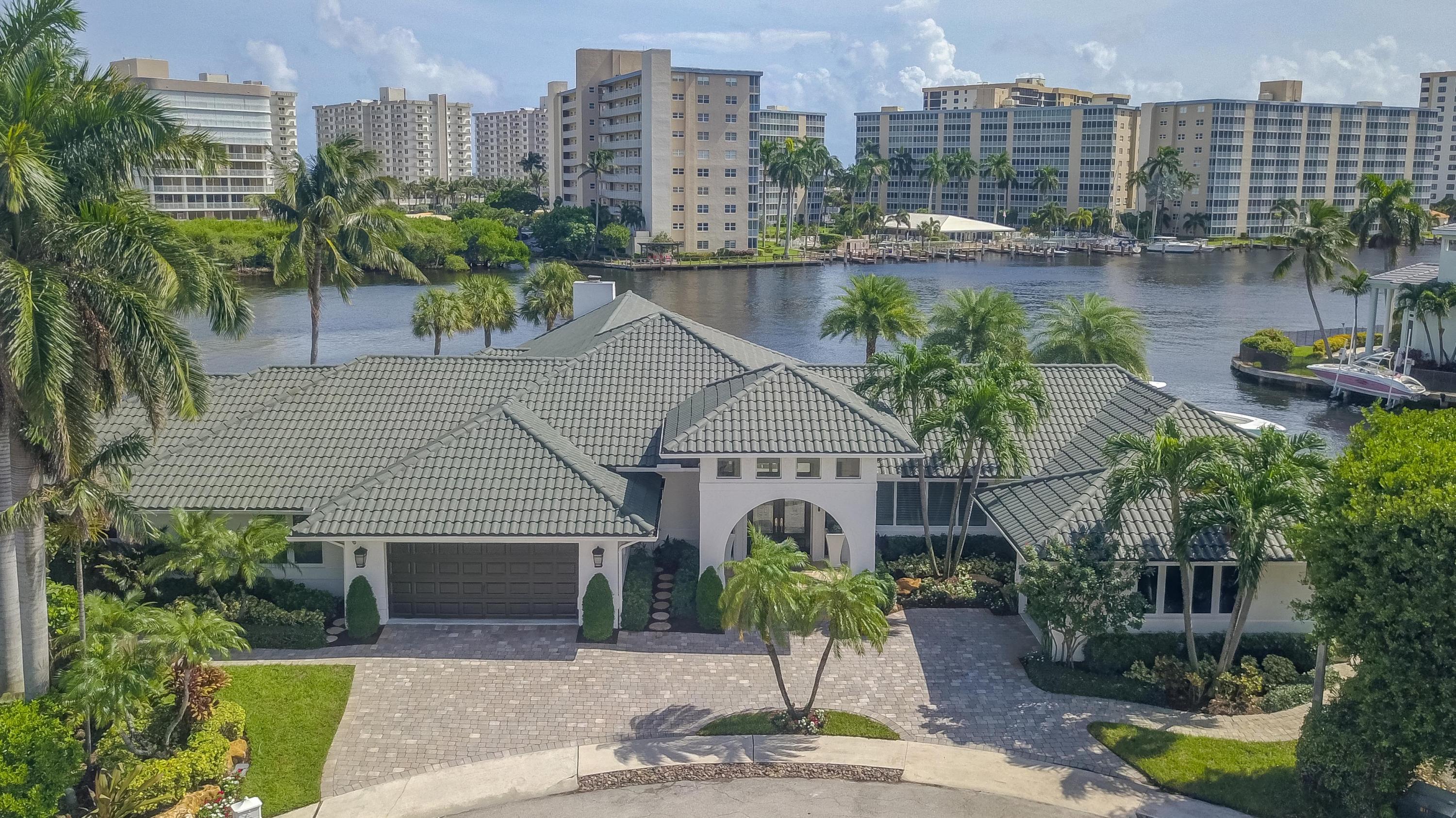 A rarely available Boca Raton dream estate located on an oversized SE point lot directly on the Intracoastal, offering exceptional South and East water views and deep water access. This Contemporary styled estate provides 270 feet of water frontage, yacht dockage, over 5,000 square feet of living space, 5 bedrooms, 5.5 bathrooms, 3 garages, home theatre, home gym/office overlooking the waterway, waterfall pool, spa and endless luxury. The professional landscaping greets you as you approach this extraordinary home. Enter and be impressed by the stunning views of the Intracoastal Waterway.  See 'More' for full details and amenities... The luxury details throughout the estate include coffered ceilings, crown moldings, grand entry foyer, imported marble and stone, chef's dream kitchen with high end gas appliances, Subzero refrigerator, spacious island, breakfast nook overlooking the water, large bar area and high-end elements throughout will leave you amazed at the thoughtful design and detailing to be found in every room. The spacious master retreat offers beautiful design elements, and a stunning view overlooking the water. You can also overlook the water from the large soaker tub in the Master en-suite. Additional features include outdoor BBQ, whole house generator and more. This is an extraordinary opportunity to own a remarkable Boca Raton estate a rarely available oversized SE point lot!

House Features -
All light fixtures stay and convey 
SONOS Sound system  Full house 
Security cameras  whole house 
Plantation shutters 
Impact glass  whole house 
Oversized Generator 
Central Vacuum
3 ac units 

Exterior -
Private Cul-de sac 
Oversized 3 car garage 
Circular driveway 
Walkways around both sides of the house. 
Property completely fenced

Great room-
Jerusalem marble throughout main living areas 
Expansive floor to ceiling windows throughout 
Neutral palette  base and crown molding 
Motorized black out shades

Master Suite -
Oversized Master bedroom suite opens up to 
Direct access to the pool patio area and views of the Intracoastal waterways
Hardwood style porcelain tile. 

Master bath -
Roman tub whirlpool 
Spectrum lights 
Double vanity 
Wood cabinets 
Marble floors
Toto toilet 
Bidet
Walk in steam shower
Walk In closet. 
Custom built ins

Dining room -
Oversized dining area for large gatherings

Bar Area -
Serves indoor and outdoor entertaining areas 

Family room -
Contemporary cut coral fireplace. 
Wood burning fireplace
Espresso wood Grooved ceiling 


Kitchen -
Raised serving bar area 
Contemporary cabinets 
Center island 
Viking stove top 5 gas burner 
Draft hood 
Subzero refrigerator and freezer
Miele dual ovens with warming drawers
Appliance garage 
Pantry wall 
Breakfast area that overlooks the Intracoastal Waterway


Media room -
Experience a movie like setting 
Leather Recliner Movie Chairs stay in media room 

Exercise room -
East exposure overlooking the Intracoastal Waterway
Sauna room  cedar steam 

Vip Suite -
Marbled floor. 
Intracoastal views
En Suite

Bedroom #2 & #3 -
Suites with porcelain wood plank floors. 
En Suite
furniture negotiable

Pool -
Oversized Spa with Rock Waterfall
Flowing river rock into the pool 
Pool recently renovated with pebble Tec finish
Pool sit out area around pool
Gas heated pool 
Marble floor decking
Outdoor speaker system


Patio -
250 feet of waterfrontage
Elevated deck  20 ft x 45 ft 
Whole House Guardian generator 
ICW  317 ft wide
Concrete seawall 
Raised deck  marine composite non maintenance
Dual Platform lift for Jet-Skis
Hydraulic boat lift 
Steel railing 
Water and Power on dock
Automatic screen enclosure for outdoor entertainment area 
Summer kitchen with Viking gas grill, icemaker and outdoor fridge
Granite countertops 
Marble floors
