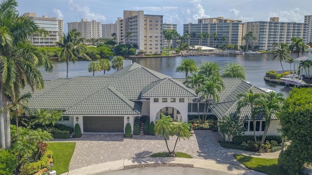 A rarely available Boca Raton dream estate located on an oversized SE point lot directly on the Intracoastal, offering exceptional South and East water views and deep water access. This Contemporary styled estate provides 270 feet of water frontage, yacht dockage, over 5,000 square feet of living space, 5 bedrooms, 5.5 bathrooms, 3 garages, home theatre, home gym/office overlooking the waterway, waterfall pool, spa and endless luxury. The professional landscaping greets you as you approach this extraordinary home. Enter and be impressed by the stunning views of the Intracoastal Waterway.  See 'More' for full details and amenities... The luxury details throughout the estate include coffered ceilings, crown moldings, grand entry foyer, imported marble and stone, chef's dream kitchen with high end gas appliances, Subzero refrigerator, spacious island, breakfast nook overlooking the water, large bar area and high-end elements throughout will leave you amazed at the thoughtful design and detailing to be found in every room. The spacious master retreat offers beautiful design elements, and a stunning view overlooking the water. You can also overlook the water from the large soaker tub in the Master en-suite. Additional features include outdoor BBQ, whole house generator and more. This is an extraordinary opportunity to own a remarkable Boca Raton estate a rarely available oversized SE point lot!

House Features -
All light fixtures stay and convey 
SONOS Sound system  Full house 
Security cameras  whole house 
Plantation shutters 
Impact glass  whole house 
Oversized Generator 
Central Vacuum
3 ac units 

Exterior -
Private Cul-de sac 
Oversized 3 car garage 
Circular driveway 
Walkways around both sides of the house. 
Property completely fenced

Great room-
Jerusalem marble throughout main living areas 
Expansive floor to ceiling windows throughout 
Neutral palette  base and crown molding 
Motorized black out shades

Master Suite -
Oversized Master bedroom suite opens up to 
Direct access to the pool patio area and views of the Intracoastal waterways
Hardwood style porcelain tile. 

Master bath -
Roman tub whirlpool 
Spectrum lights 
Double vanity 
Wood cabinets 
Marble floors
Toto toilet 
Bidet
Walk in steam shower
Walk In closet. 
Custom built ins

Dining room -
Oversized dining area for large gatherings

Bar Area -
Serves indoor and outdoor entertaining areas 

Family room -
Contemporary cut coral fireplace. 
Wood burning fireplace
Espresso wood Grooved ceiling 


Kitchen -
Raised serving bar area 
Contemporary cabinets 
Center island 
Viking stove top 5 gas burner 
Draft hood 
Subzero refrigerator and freezer
Miele dual ovens with warming drawers
Appliance garage 
Pantry wall 
Breakfast area that overlooks the Intracoastal Waterway


Media room -
Experience a movie like setting 
Leather Recliner Movie Chairs stay in media room 

Exercise room -
East exposure overlooking the Intracoastal Waterway
Sauna room  cedar steam 

Vip Suite -
Marbled floor. 
Intracoastal views
En Suite

Bedroom #2 & #3 -
Suites with porcelain wood plank floors. 
En Suite
furniture negotiable

Pool -
Oversized Spa with Rock Waterfall
Flowing river rock into the pool 
Pool recently renovated with pebble Tec finish
Pool sit out area around pool
Gas heated pool 
Marble floor decking
Outdoor speaker system


Patio -
250 feet of waterfrontage
Elevated deck  20 ft x 45 ft 
Whole House Guardian generator 
ICW  317 ft wide
Concrete seawall 
Raised deck  marine composite non maintenance
Dual Platform lift for Jet-Skis
Hydraulic boat lift 
Steel railing 
Water and Power on dock
Automatic screen enclosure for outdoor entertainment area 
Summer kitchen with Viking gas grill, icemaker and outdoor fridge
Granite countertops 
Marble floors