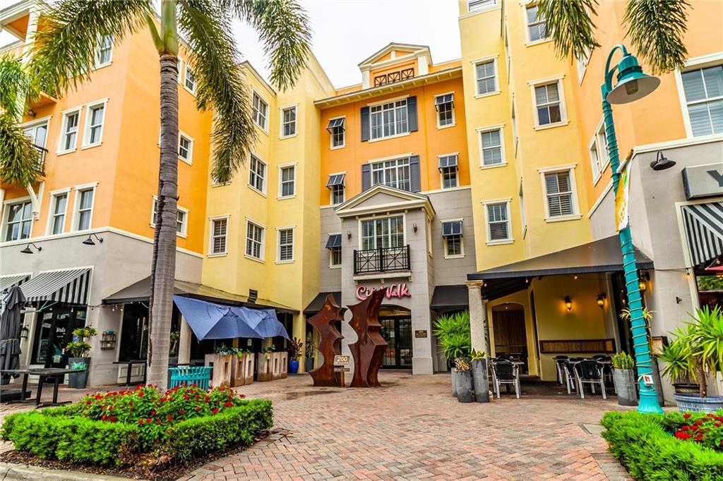 Fabulous location with spectacular views from top floor condo in desirable City Walk at Pineapple Grove! Just Steps from Atlantic Ave. dining, shopping, nightlife & walking distance to Delray Beach oceanfront. This gorgeous unit features custom arches & updated fixtures/finishes throughout this 2/2.5 + Den (perfect to convert into a 3rd bedroom or Home Office). Fabulous gourmet kitchen offers granite counters, stainless steel appliances, custom cabinets and an oversized pass-through. Primary Bedroom features 2 walk-in closets and in suite bath with double sink vanity, water closet, soaking tub and shower with custom stonework. Unit has laundry room, covered parking and impact glass offering additional security and convenience, while the balcony offers great views of the surrounding area.