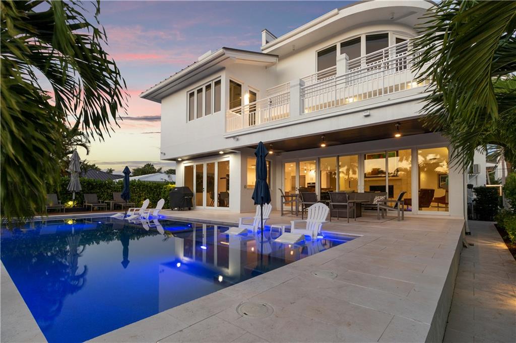 Experience the WOW factor the moment you enter this completely updated transitional contemporary waterfront home with a luminous open floor plan, walls of glass, volume ceilings and an open floor plan. The culinary open kitchen overlooks the great room, dining area covered loggia, pool, patio area and waterway. The ultimate retreat can be found in the primary suite & lavish bathroom. Large home office for those who work from home. Multiple doorways blend indoor and outdoor living spaces taking advantage of the S. Florida lifestyle. A day at sea is as close as your back door with fast access to the Intracoastal waterway and inlet to the ocean. Sq ft. from IMAPP.