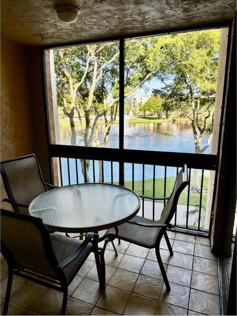 Fully furnished, spacious 2-bedroom, 2-bath condo with an open kitchen/living area and a utility room featuring a washer and dryer. Rent includes water, cable, and Wi-Fi. Enjoy breathtaking lake views from your screened-in balcony. Located in a prime location, just a short walk to shopping and minutes from the beach and downtown Delray! Annual, Seasonal, Short-term and Off-season rental available - 3 month minimum for short-term and off-season.