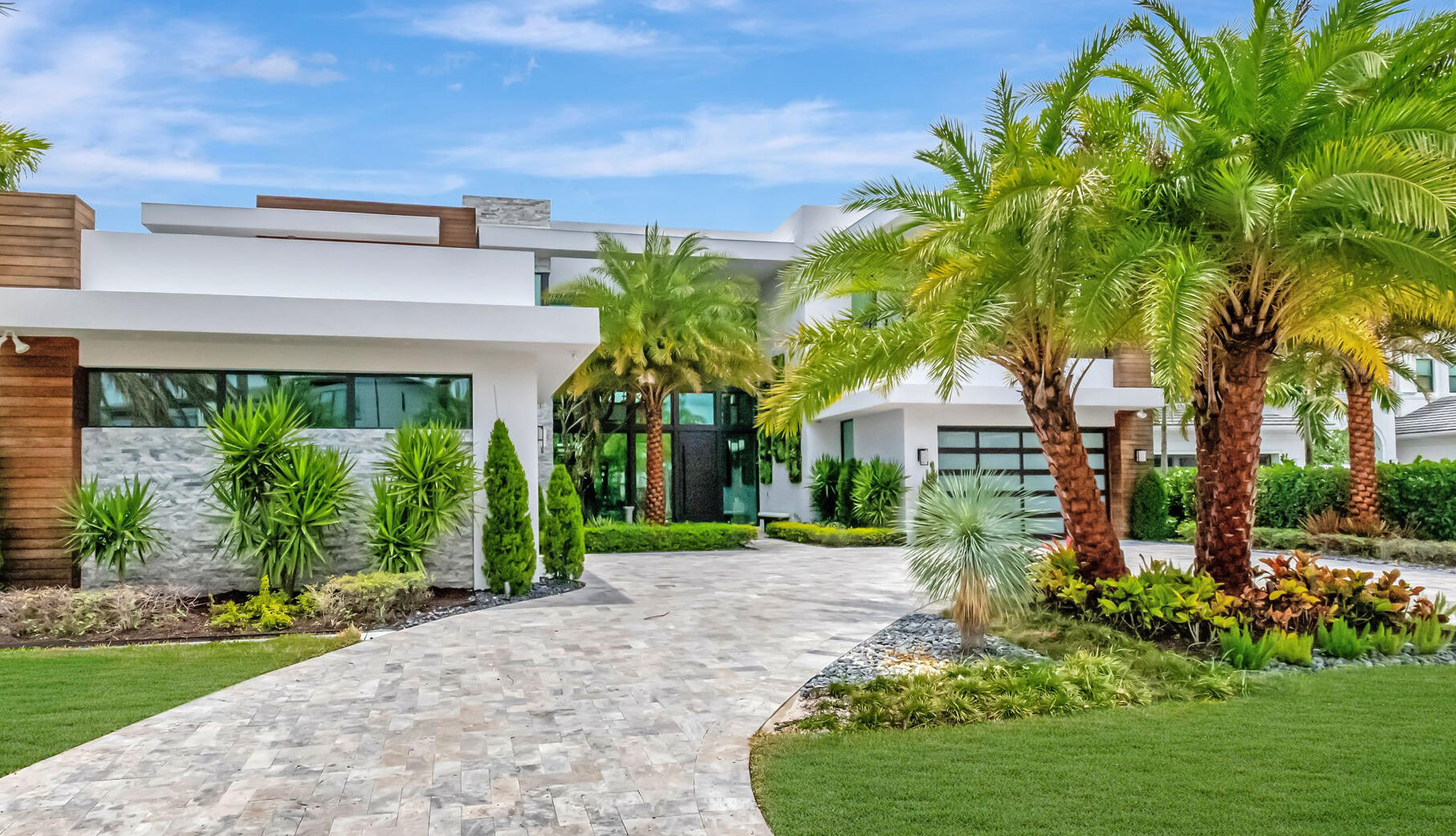 WELCOME TO THIS LAVISH MODERN LUXURY ESTATE LOCATED IN THE ENCLAVE SECTION OF PRESTIGIOUS BOCA BRIDGES. THIS DISTINGUISHED ''DALI'' 
CONTEMPORARY MASTERPIECE, ONLY SEVEN OF ITS KIND, SPANS 8,000 SQ.FT, WHERE MODERN ARCHITECTURE MEETS SOPHISTICATED ELEGANCE. THE COVETED ''DALI'' MODERN ESTATE IS LOCATED ON ONE OF THE LARGEST WATERFRONT LOTS IN BOCA BRIDGES! NESTLED  INTO A PRIVATE CUL DE SAC. THIS OPEN CONCEPT FLOOR PLAN HAS SOARING CEILINGS AND WALLS OF SMART GLASS THAT SURROUND YOU WITH BREATHTAKING VIEWS. WITH OVER TWO MILLION DOLLARS IN AFTERMARKET CUSTOMIZED UPGRADES, YOU WILL BE BEDAZZLED BY THIS ULTIMATE SHOWCASE HOME DESIGNED BY NIKKI LEVY INTERIORS BOCA. BOASTING 6 BEDROOMS AND 7 1/2 LUXURIOUS BATHS THIS RESIDENCE IS A TESTAMENT TO LUXURY LIVING. YOU WILL BE WOWED BY THE DRAMATIC ENTRY FOYER FEATURING A CIRCULAR TIERED CEILING AND THE CUSTOM WHITE OAK FLOORING WITH 10 INCH WIDE PLANKS INSTALLED IN A CHEVRON PATTERN. YOUR EYES WILL BE DRAWN TO THE EXTERIOR WALLS OF 16FT OF SLIDING GLASS OVERLOOKING YOUR OUTDOOR PARADISE. AN AMAZING CUSTOM BUILT-IN 550 GALLON TWO SIDED FISH TANK SEPERATES YOUR ENTERTAINMENT AREAS. THE EXPANSIVE GOURMET KITCHEN IS OUTFITTED WITH TOP OF THE LINE FINISHES AND WOLF AND SUBZERO APPLIANCES. THIS ULTRA CHIC KITCHEN BOASTS HIGH END DESIGNER CABINETRY,  WATERFALL COUNTERTOPS, HIDDEN APPLIANCE GARAGE, A WALK-IN PANTRY AND CUSTOM PORCELAIN TILE. ASCEND TO THE UPPER LEVEL VIA THE OPEN RISE GLASS ENCLOSED STAIRCASE OR YOUR CUSTOM WOOD VENEERED ELEVATOR. THE LUXURIOUS MASTER RETREAT WITH OUTDOOR BALCONY IS COMPLEMENTED WITH A FIREPLACE, SITTING AREA, COFFEE BAR, VALET CLOSETS AND DRESSING ROOMS. THE SPA MASTER BATHROOM FEATURES A STEAM SHOWER WITH A MARBLE WALL OF SPRAY HEADS. ALL ADDITIONAL RETREAT BEDROOMS ARE COMPLETE WITH EN SUITE BATHS AND LARGE CLOSETS. THE LOFT IS A PERFECT AREA FOR GAMING AND ENTERTAINMENT. EXPERIENCE AN ELEVATED LIFESTYLE IN YOUR RESORT BACKYARD AN ODE TO ENTERTAINING AND RELAXATION. LOOK NO FURTHER THAN THE VAN KIRK DESIGNED SWIMMING POOL WITH SPA HOT TUB, LOUNGING SHELVES, WATER FEATURES AND ACCENT LIGHTING. THE OUTDOOR ENTERTAINMENT AREA HAS MARBLE PATIOS, A SUMMER KITCHEN WITH GRILLING STATION, PIZZA OVEN, AND BEVERAGE STATIONS, AND A PRIVATE CABANA BATH. ALL ENCLOSED WITHIN A MOTORIZED LOUVERED PERGOLA. THIS IS A TROPICAL PARADISE FOR ALL SEASONS. THIS SANCTUARY ALSO INCLUDES A MARBLE PAVED CIRCULAR DRIVEWAY, WHOLE HOME GENERATOR, WHOLE HOME WATER FILTRATION SYSTEM, CUSTOM BUILT-IN CABINETRY IN OFFICE AND MUDROOMS, LUTRON CUSTOM SHADES AND DRAPES, SONOS SOUND WITH SMART HOUSE TECHNOLOGY, AND MORE! BOCA BRIDGES LIFESTYLE AMENITIES INCLUDE
A 27,000 SQ FT CLUBHOUSE WITH YOUR OWN ON SITE RESTAURANT AND BAR, A WORLD CLASS FITNESS STUDIO WITH SPA, AND YOGA CLASSES.THERE ARE TENNIS AND PICKLEBALL COURTS AND AN INDOOR BASKETBALL COURT. RELAX AT THE LUXURIOUS OUTDOOR POOL FEATURING AN OUTDOOR FULL SERVICE BAR. CHILDREN, FAMILIES, AND FRIENDS WILL ENJOY THE OUTDOOR SPLASH WATERPARK, PLAYGROUND, AND PAVILLION.