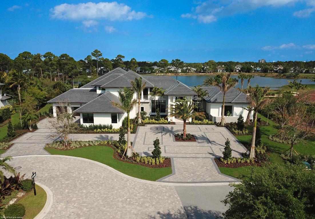 Brand new, one-of-a-kind Avalon model situated on a desirable 1 acre homesite overlooking a tranquil lake and the 12th hole of the Raymond Floyd designed golf course.  This exquisite builder model offers stunning golf views with five bedrooms, six full and two half baths.  Offering the finest in luxury living including  a formal living room; dining room with a fully equipped bar and featured wine room; separate great room; handsome club room; gourmet kitchen with custom designed cabinetry and separate catering kitchen; office; 12' floor to ceiling windows offering tropical views to the rear garden and resort-style pool and spa.  The expansive master suite has a vestibule entryway, sitting area, his and her walk in closets and master baths.  Spacious guest rooms suites with walk in closets.