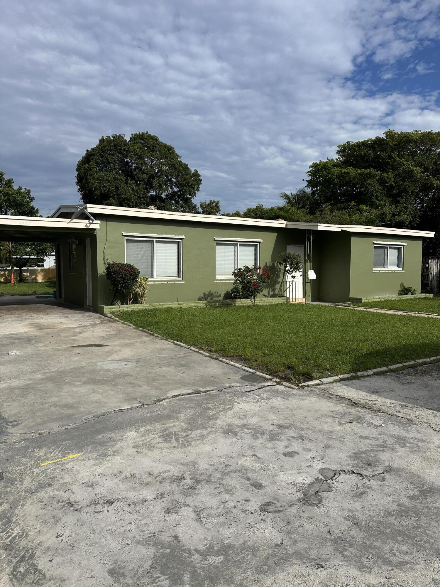 This charming Single-Family Residence (SFR) with 3 bedrooms and 2 bathrooms is located in the heart of Boynton Beach, in a quiet residential neighborhood, just minutes from the beach, downtown, restaurants, shops, and major highways. It features a spacious layout and private parking. The property offers easy access to I-95 and nearby marinas. Enjoy your own backyard oasis with a variety of fruit trees. This home can be rented as a full residence or split into two separate 2/1 and 1/1 units with independent entrances, making it perfect for roommates or multi-family living.