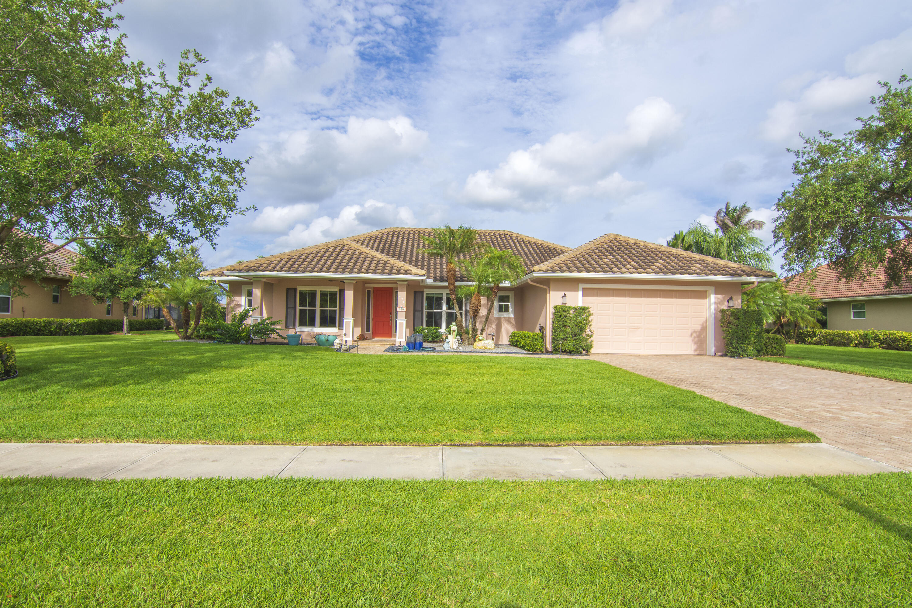 Exceptional Stony Brook Farms residence on a premium lot, offered in pristine, show-ready condition. The resort-style outdoor living package is unrivaled — a 15 x 32 pool with 8 x 8 in-ground spa anchors a sprawling 25 x 65 screened enclosure, complemented by a generous 12 x 25 covered lanai. Inside, a chef's kitchen and formal dining room are appointed with custom finishes executed to the highest standard. The oversized two-car garage features professional epoxy flooring. Residents enjoy a private HOA-included clubhouse with pool. A rare opportunity to own a move-in-ready home combining elevated indoor craftsmanship with exceptional outdoor entertaining scale in one of the area's most sought-after communities.