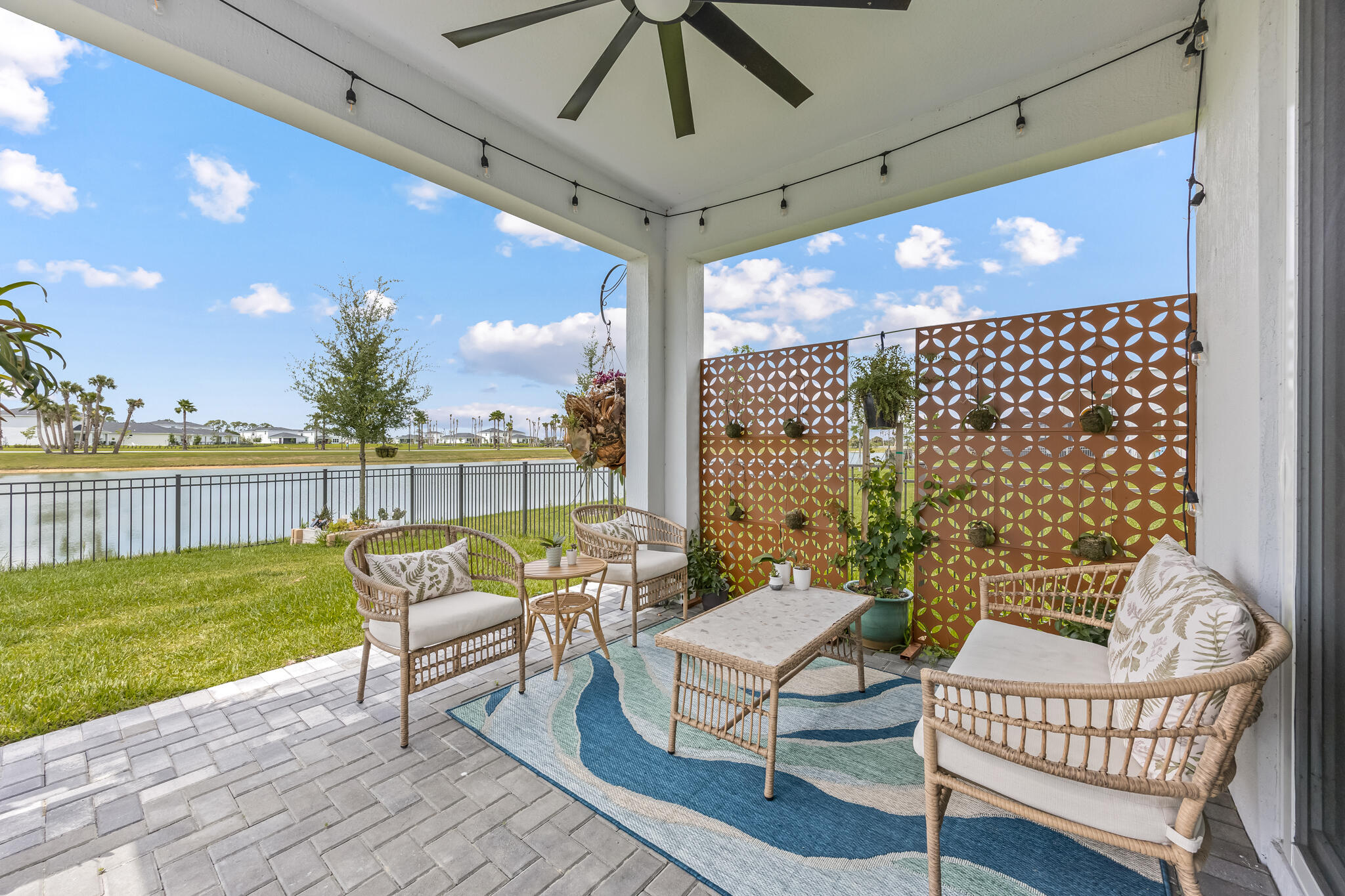 THE ONLY LAKEFRONT HOME AVAILABLE with no competing For Sale signs and direct access to the community pool and clubhouse just steps from your backyard! This beautifully upgraded home in the sought-after Riverwood at Everlands offers the perfect combination of comfort, style, and convenience. The bright open-concept floor plan features a gorgeous remodeled kitchen with modern finishes, custom wood beam accents, luxury flooring throughout, hurricane impact windows, and no carpet. The spacious owner's suite provides a peaceful retreat, while the additional bedrooms offer flexibility for family, guests, or a home office. Relax or entertain in your fully fenced backyard overlooking the tranquil lake with no rear neighbors. Conveniently located near shopping, dining, and major roadways, this mov