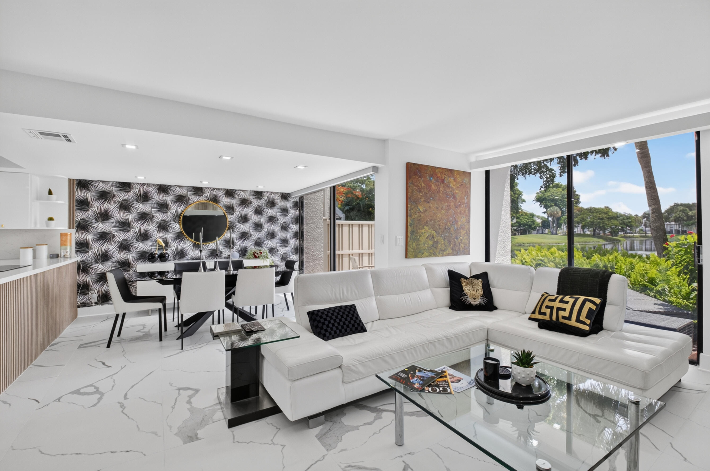 Rare gold cart parking immediately adjacent to the unit! Experience premium resort living in this beautifully furnished and fully renovated waterfront townhouse in Bridgewood at Boca West. This turnkey 3BR/2.5BA residence offers a meticulously designed two-story living space. The open chef's kitchen boasts stunning countertops, elegant cabinetry, and newer appliances. Relax to fabulous, sweeping water views in a prime location just a short stroll or golf cart ride away from Boca West's premier dining, fitness center, pools, and vibrant club activities. Mandatory Joining Fee: $150,000, BWMA Capital Contribution: $10,000, Annual Social Dues: $24,454. *Club's Joining Fee & CC will be increasing by $75,000 on October 1st. Act now to beat the increase!