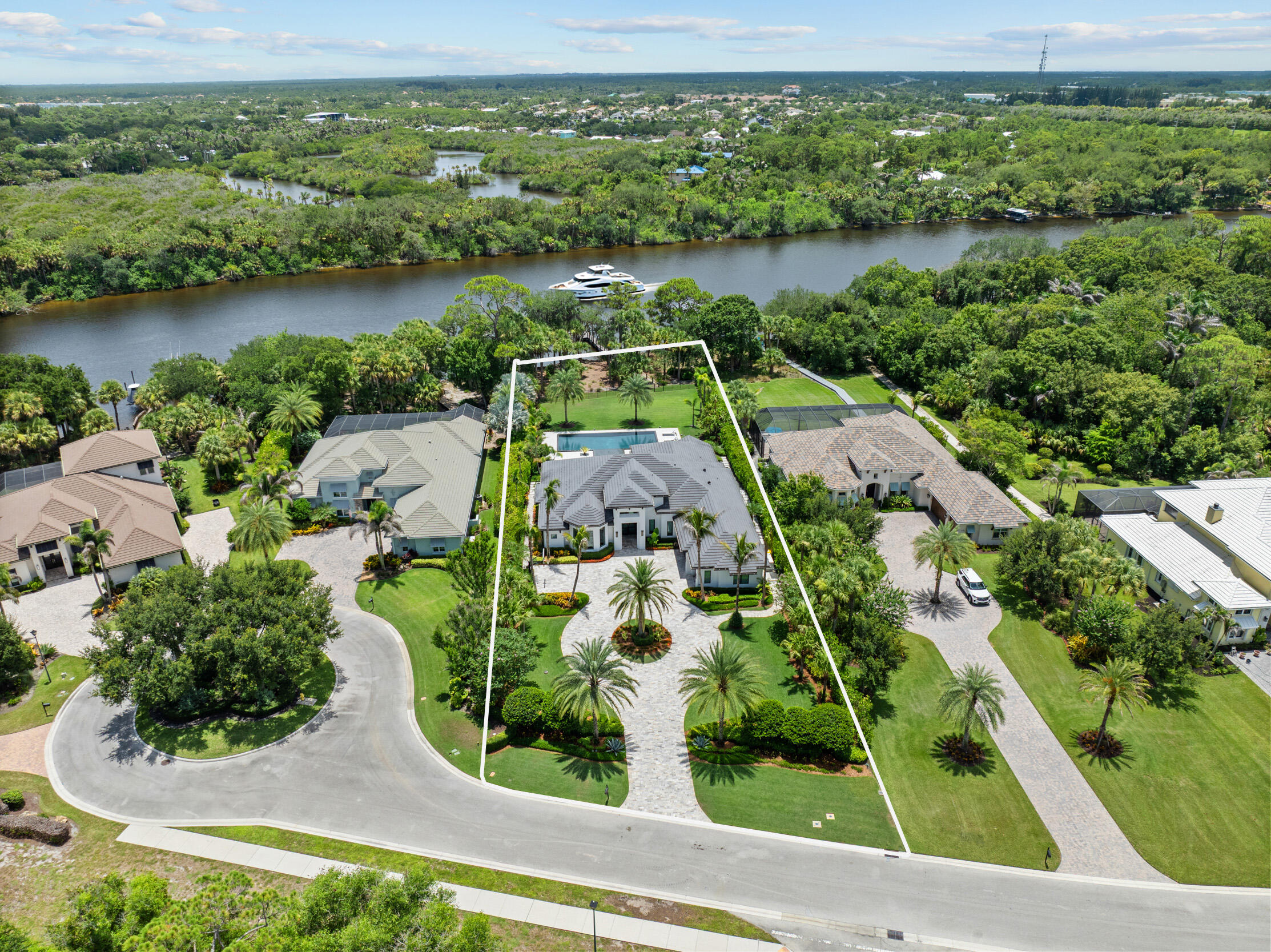 Welcome to this extraordinary waterfront estate in the gated community of Highlands Reserve. Thoughtfully customized with over $1.2 million in documented owner-directed upgrades, this residence showcases exceptional craftsmanship, designer finishes, and uncompromising attention to detail throughout. A breathtaking 360-degree infinity-edge pool creates a true resort-caliber setting, complemented by professionally designed landscaping and expansive outdoor living spaces. Enjoy direct ocean access with no fixed bridges, a Trek composite dock with a 16,000-pound boat lift and high-speed PWC lift, plus a whole-home generator for added peace of mind. A rare opportunity to own one of Palm City's most exceptional waterfront homes.