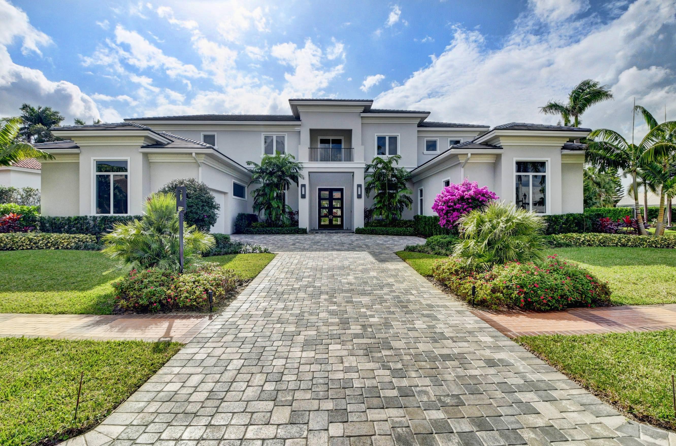7661 Scarsdale Way is masterfully designed and constructed to perfectly fit its oversized .44 acre fairway lot. The home is stylish and modern featuring an elegant and contemporary Great Room layout with soaring 26-foot coffered ceilings. This magnificent 6,300 sq. ft. Estate Home includes 5 spacious bedrooms, 6 full baths, 2 powder rooms, den/office & bar, elevator, open concept entertaining areas, plus a 3-car plus golf cart garage. The finest materials, finishes and craftsmanship showcase this home with custom 24'' x 48'' white designer porcelain floors that add to the appeal and provide the neutral palette capable of handling all decorative touches. Furnished by Clive Daniels with immediate occupancy. More... 17661 Scarsdale Way is masterfully designed and constructed to perfectly fit its oversized .44 acre fairway lot. The home is stylish and modern featuring an elegant and contemporary Great Room layout with soaring 26-foot coffered ceilings. This magnificent 6,300 sq. ft. Estate Home includes 5 spacious bedrooms, 6 full baths, 2 powder rooms, den/office & bar, elevator, open concept entertaining areas, plus a 3-car plus golf cart garage. The finest materials, finishes and craftsmanship showcase this home with custom 24'' x 48'' white designer porcelain floors that add to the appeal and provide the neutral palette capable of handling all decorative touches. Furnished by Clive Daniels with immediate occupancy.

*Seller Will Pay the non-refundable portion of the St. Andrews Initiation Fee if buyer closes before.
July 1, 2020.*
The gourmet chef's kitchen features all high-end Thermador appliances, multiple ovens, convection cooktop, four foot galley sink workstation, 100 bottle wine cooler and a secret, hidden oversized pantry. The Master Suite includes a morning bar, separate his and her bathrooms, and a "her" closet measuring over 200 sq. ft. finished with all high-end details that must be seen to be believed.The upstairs features wide-planked hardwood floors, 4 additional en-suite bedrooms all with walk-in closets and a loft area that overlooks the Great Room below. Outdoors, the lushly landscaped property features a dramatic resort style pool,covered loggia with summer kitchen and golf course views beyond.Furnished by Clive Daniels with immediate occupancy. Membership to St Andrews CC is required at time of closing. Included in the monthly fee is a $50 per month assessment that is estimated to end in 2023.
ADDITIONAL FEATURES
Full House 48kw Generator
Control 4 Smart Home Automation System
Gas Pool Heater
Finished Closets Throughout
Hurricane Impact Glass Doors and Windows
Thermador Steam Oven
Thermador Induction Cooktop
Thermador Wine Cooler
Outdoor Lighting
4 Zone High Efficiency Trane AC's
Outdoor Barbecue
Electrolux Washer/Dryer Package
Central Vacuum throughout
Large Utility Room with Extra Storage
Resort Style Pool with built in heated spa and sun shelf
100" Linear Fireplace
Integrated Speaker System in Main Rooms and Master
Builder's One Year Warranty
