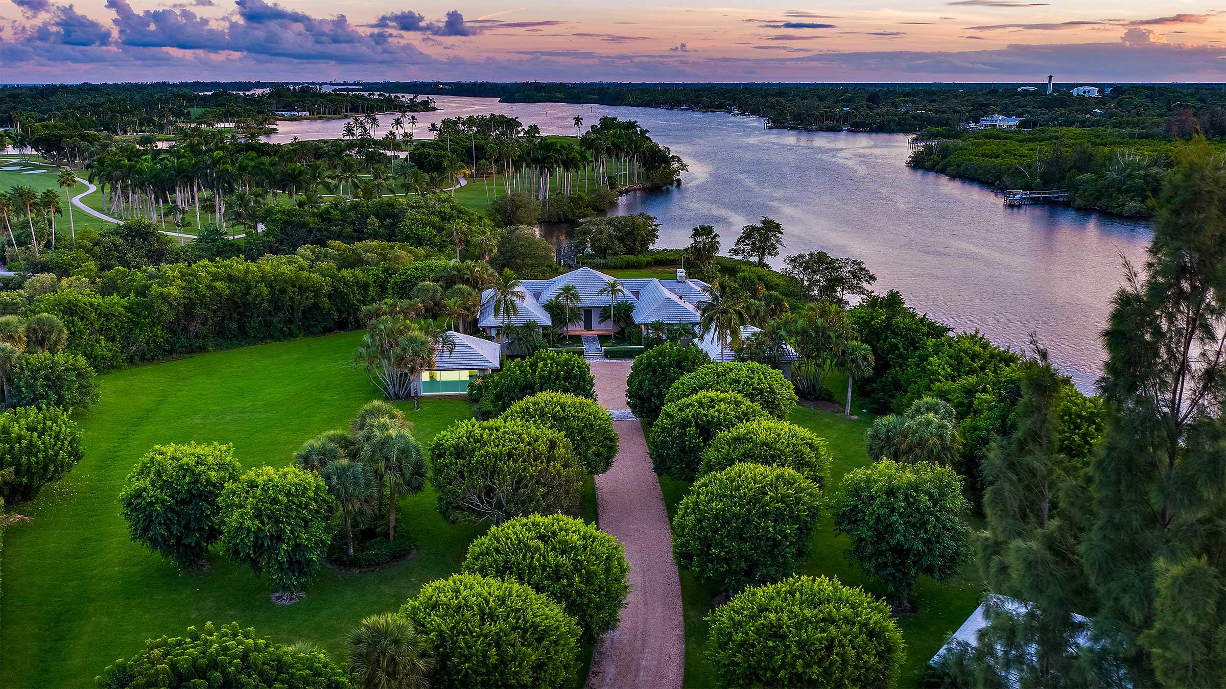 Rarely available 3.4 acre waterfront Jupiter Island estate featuring picturesque panoramic views of the Intracoastal and the Jupiter Island Club golf course. Renovate existing home or design your own private estate. Property can also be subdivided. A must see!
