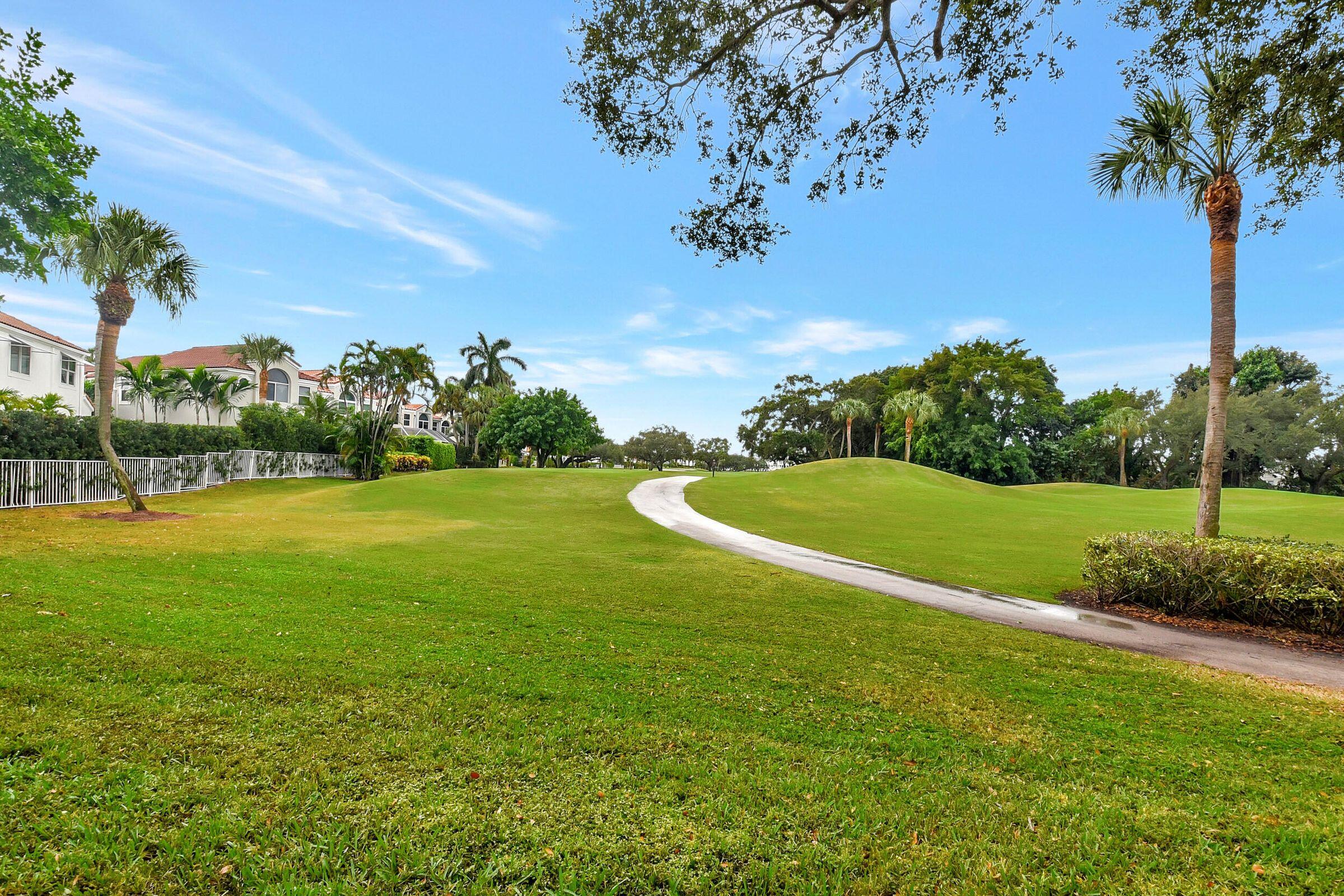 Perfectly located first floor condo residence with a long view of the golf course from the living area, patio and kitchen. Updated bathrooms. Laminate flooring. No carpet. Guard gated community. Fairways community pool. Enjoy East Boca Raton lifestyle - close to downtown Boca and Delray - shopping, dining and the beaches.