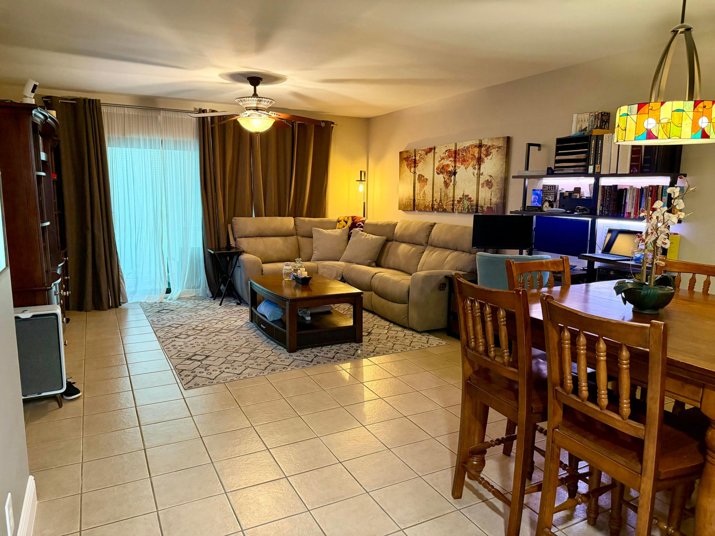 Location, Location, Location! Beautifully updated first-floor corner 2-bedroom, 2-bath condo just 2.2 miles from the beach, Pompano Beach Pier, and waterfront dining. This move-in-ready home features an updated kitchen with wood cabinetry, granite countertops, stainless steel appliances, and modern finishes. The split-bedroom layout offers privacy, while the spacious primary suite features abundant natural light and a walk-in closet with custom built-ins. Upgrades include impact windows and sliding glass door, hurricane-rated front door, newer A/C, updated electrical panel, new interior doors, and an in-unit washer and dryer. All assessment paid in full. Enjoy peaceful garden views from the screened porch. Community amenities include a pool, spa, tennis courts, clubhouse, game room.