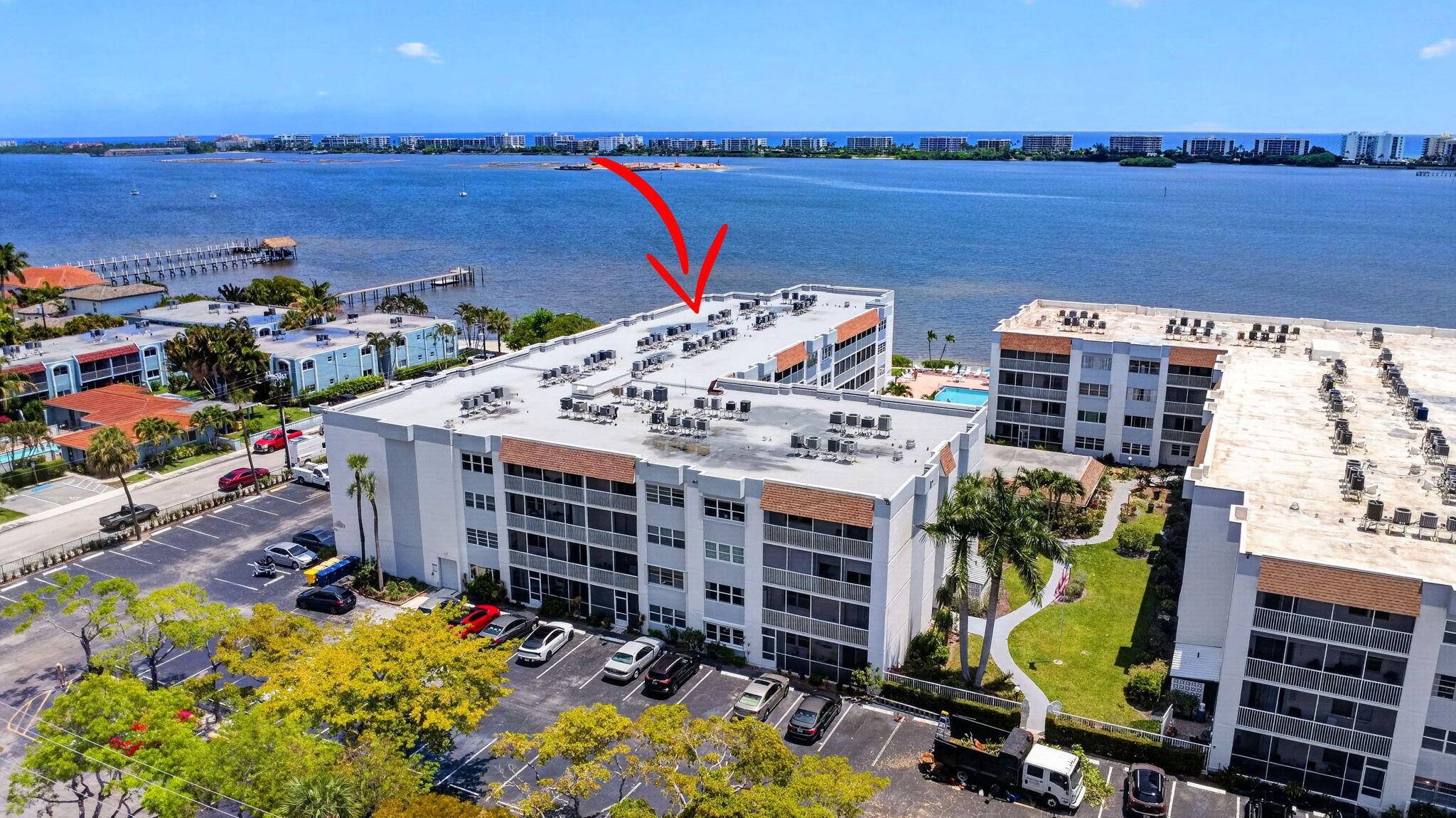Experience sophisticated coastal living in this exquisitely remodeled 2-bed/2-bath condo, perfectly positioned on the second floor with northeast Intracoastal views. Impact glass windows flood the open-concept living space with natural light, highlighting wood-look tile flooring, custom wood cabinetry, granite countertops, and premium LG appliances. Both luxurious bathrooms feature walk-in showers, and both bedrooms offer ample walk-in closets. Located in a secure, senior community, residents enjoy a resort-style heated pool with direct Intracoastal view, beach area, community room with billiard table and saunas - an elegant sanctuary for waterside living. Relax on your large screened-in balcony or drive to nearby restaurants, shops, and beaches.  Minutes from I95 and the airport.