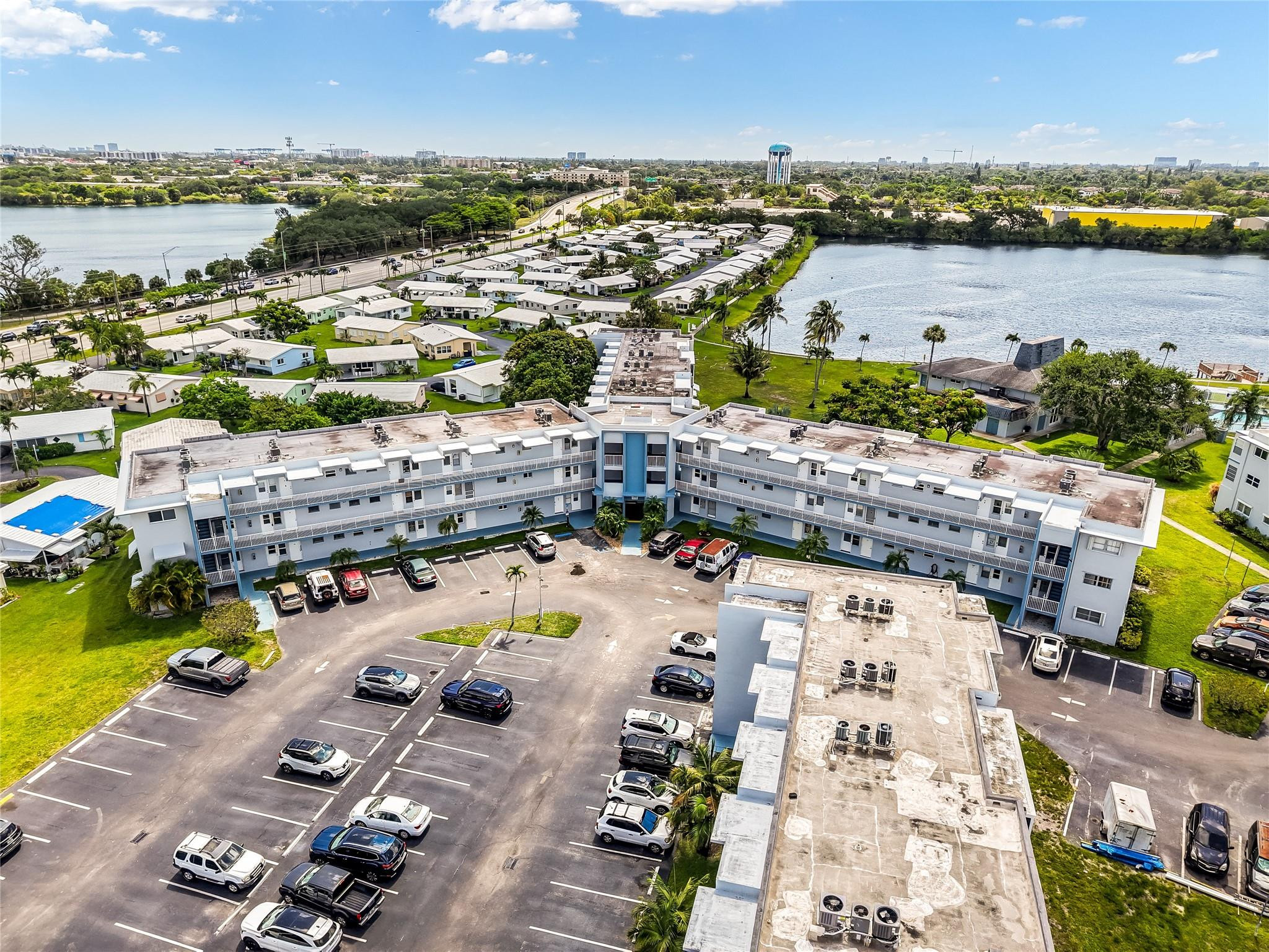 Welcome to your own slice of South Florida paradise! This beautifully updated 1-bedroom, 1.5-bath residence is nestled on the second floor of a well-maintained and highly desirable 55+ community, offering the perfect blend of comfort, convenience, and an active lifestyle. Step inside to discover a bright and inviting interior featuring tile flooring throughout, fresh paint, stainless steel appliances, and tranquil garden views that create a peaceful retreat you'll love coming home to. The building offers elevator access and convenient community laundry facilities located on the same floor. Rent includes water, cable, high-speed internet, fitness center access, sauna, pool, and more! One assigned parking space and plenty for guests. Can rent furnished or unfurnished! This vibrant and welcoming community is known for its beautifully landscaped grounds and exceptional amenities, including a clubhouse, sparkling swimming pools, fitness center, scenic lakefront sitting and fishing areas, and an active social calendar filled with bingo nights, movie nights, holiday celebrations, and community gatherings. Whether you're looking to stay active, make new friends, or simply relax in the Florida sunshine, you'll find it here. Seasonal and year-round residents alike will appreciate the unbeatable location. Just minutes from the world-famous Seminole Hard Rock Hotel & Casino, pristine South Florida beaches, Hollywood International Airport, TY Park, Yellow Green Farmers Market, shopping, dining, entertainment, and major highways including I-95 and US-1.  Whether you're searching for a seasonal escape, retirement retreat, or affordable Florida home, this move-in-ready condo offers the carefree lifestyle you've been dreaming of. Don't miss this opportunity to enjoy resort-style living in one of Hollywood's most convenient and desirable 55+ communities.