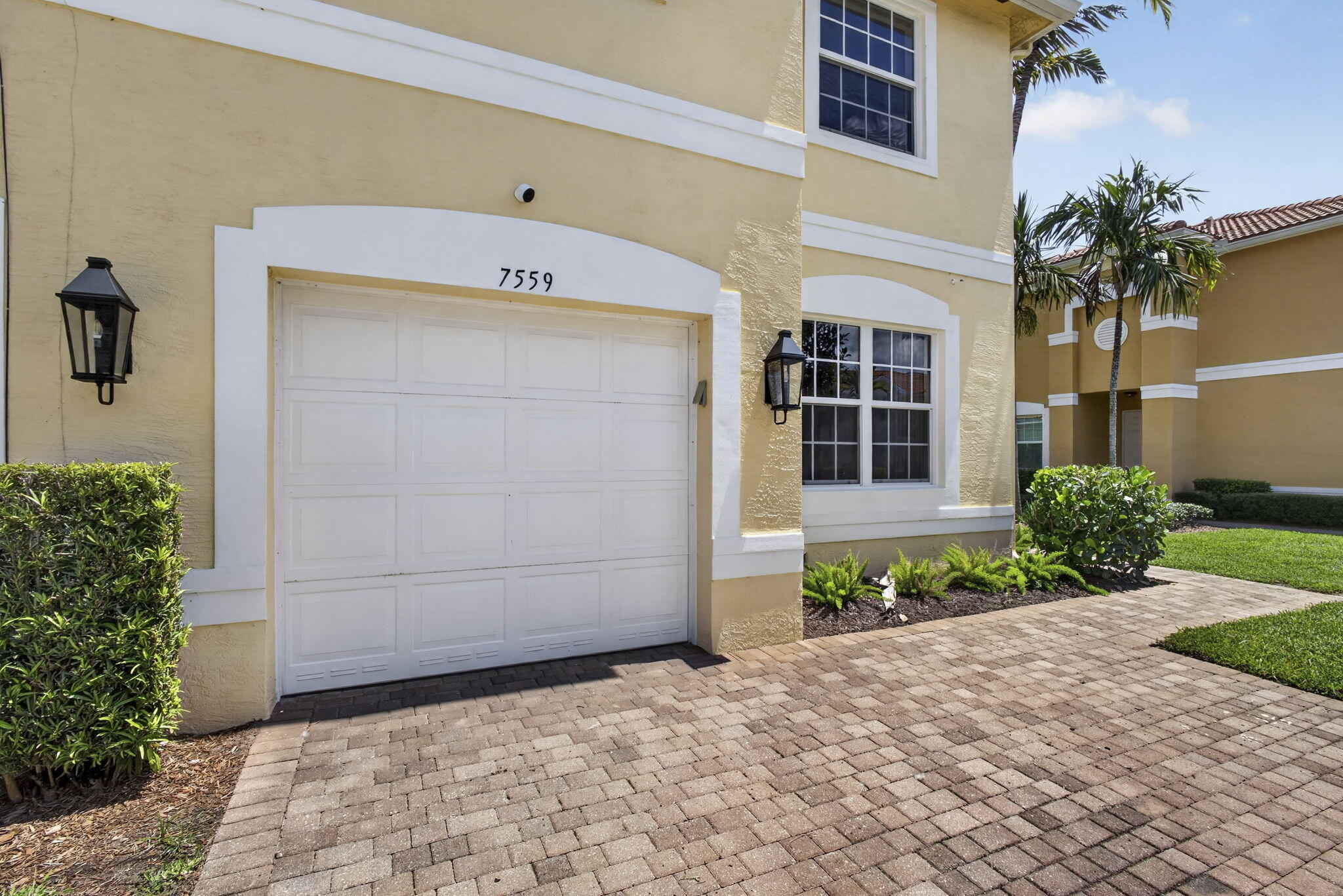 Rarely Available! Completely updated 3-bedroom, 3-bathroom townhouse in the highly sought-after Greystone community. Complete with brand-new hurricane impact windows throughout, this move-in-ready home offers both style and peace of mind. The spacious floor plan includes a versatile downstairs flex room, perfect for a home office, playroom, gym, or guest space, conveniently located next to a full bathroom. Upstairs, you'll find three generously sized bedrooms, including a spacious primary suite with an en-suite bath. The one-car garage provides added convenience and storage. The HOA maintains the roof, helping simplify homeownership. Enjoy resort-style amenities, a gated community, and a prime location close to shopping, dining, schools, and major highways.