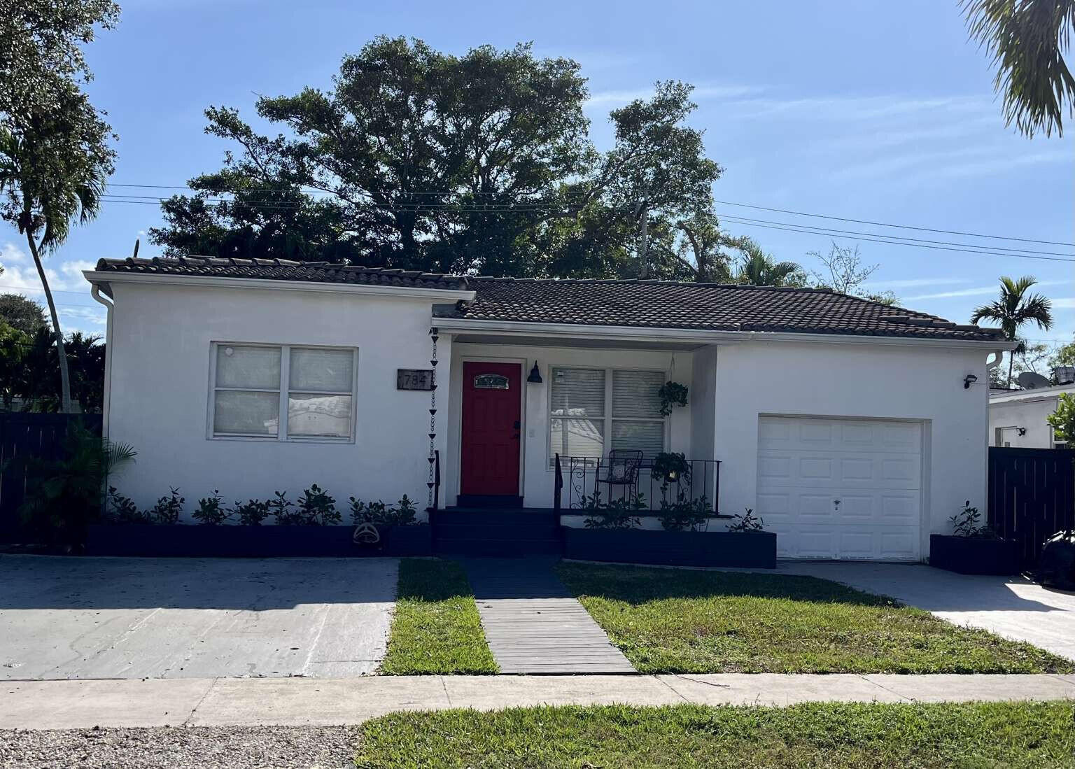 Beautiful 3-bedroom, 2-bath home in Shore Crest, sometimes referred to as the East Miami Shores area. The split-bedroom floor plan offers a spacious layout, and the outdoor space provides a relaxing setting for weekends or everyday downtime. Located about 10 minutes from North Beach and Midtown. Exterior and interior photos show the home as it appeared when staged; the property is currently vacant and unfurnished.