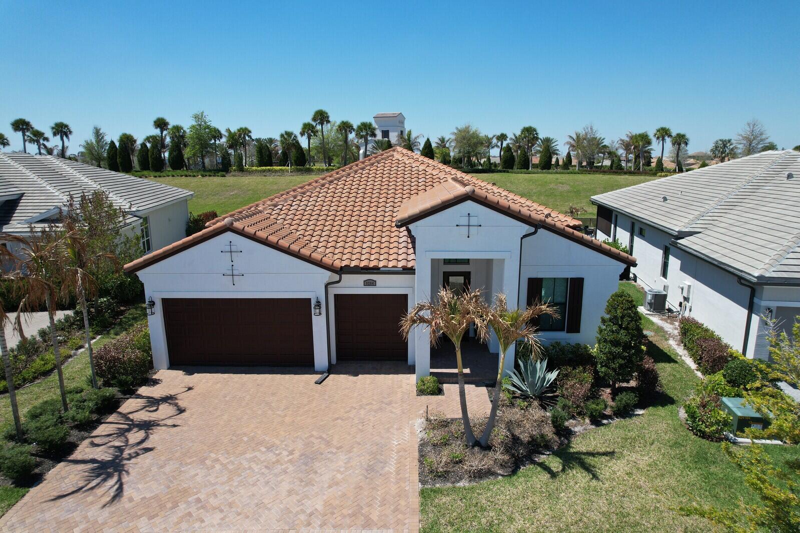 Stunning 3 Bedroom, 3 Bath Home in PGA Village Verano. Step into modern Florida living in this beautifully designed 2023-built home located in the highly sought after, all-inclusive community of PGA Village Verano. With contemporary décor, an open-concept layout, and premium finishes throughout, this residence offers both comfort and sophistication. The home Features 3 spacious bedrooms & 3 full bathrooms, Modern, open layout ideal for entertaining, Extended covered & screened patio—perfect for relaxing outdoors year round and Extended 3 car garage with ample storage and large yard with lots of room to add a pool. Residents of PGA Village Verano enjoy resort style living, access to Club Talavera, pools, fitness, tennis, pickleball & so much more!
