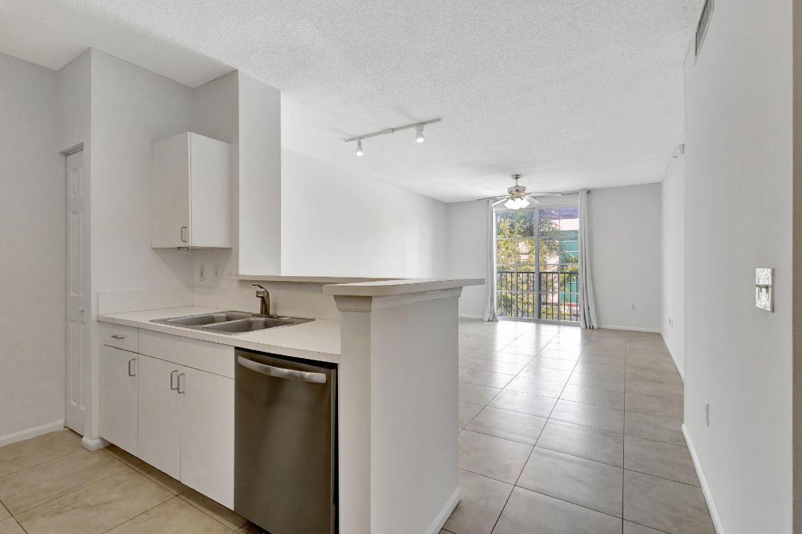 LOCATION, LOCATION, LOCATION. Rented until July 15th 2026' at $2,075 per month. (Tenant may depart earlier) 1-bedroom, 756 sq ft. Fresh paint. Stainless steel appliances, all tile, newer A/C unit, and washer-dryer. Next to the elevator. Parking space #482. Lowest HOA fees in town. Rent right away, annual or 30-night minimum (up to 12 times per year). Walk to 360 Rosemary, Brightline, Publix, bars, retail, the Kravis Center, convention center, and restaurants. Tri-Rail, Clematis Street, the waterfront, and Palm Beach are all within 1.5 miles. PBI Airport is just 10 minutes away.