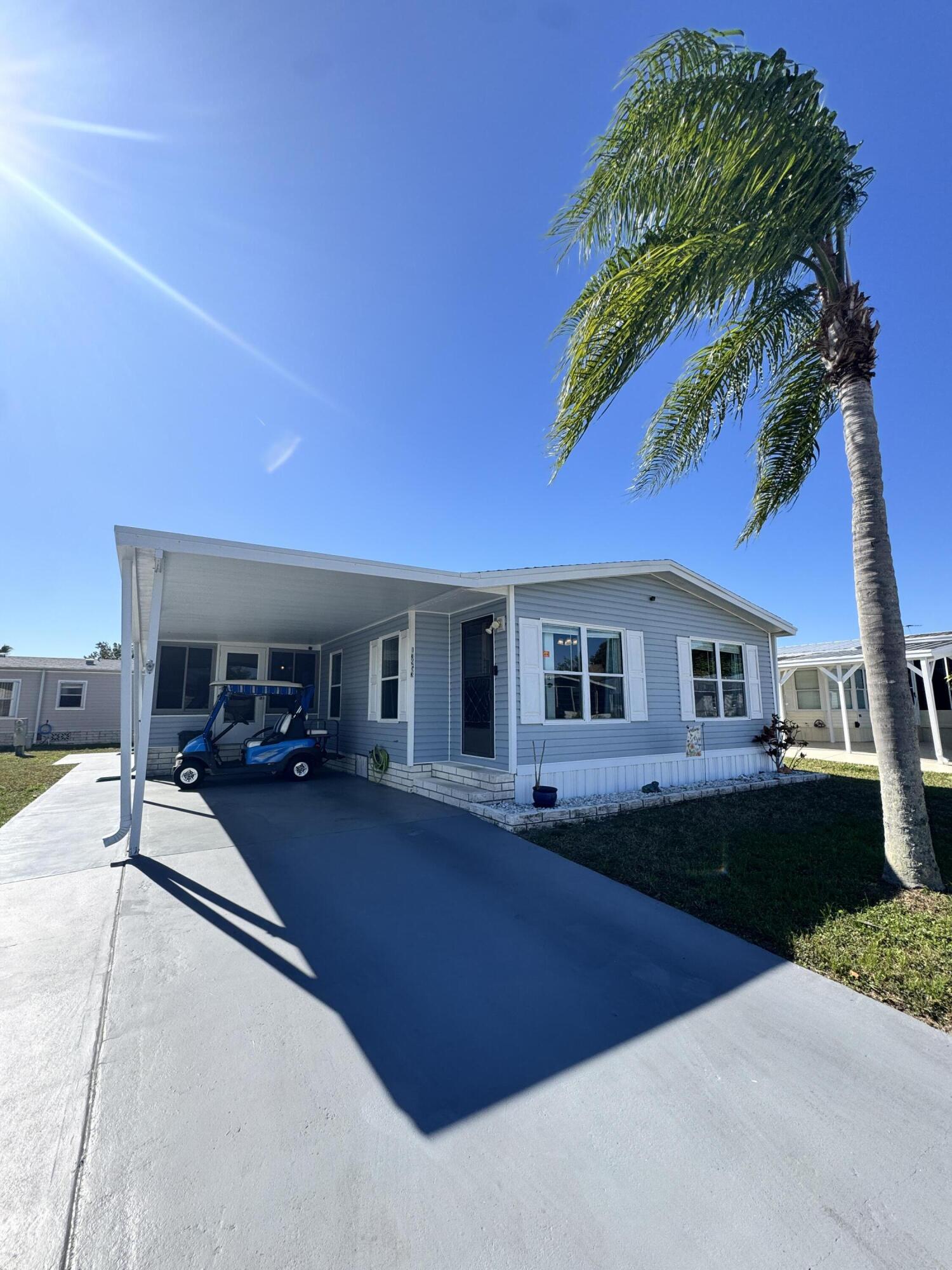 Well-maintained 2-bedroom, 2-bath home in the desirable 55+ Spanish Lakes Fairways community. This home is very close to the park entrance and sits on a quiet street. The home has no carpet and laminate floors throughout. This home is being sold furnished. The home's roof was replaced in 2021, the A/C in 2021, and the vapor barrier in 2021. The kitchen stove is 2024. The home has a lovely lanai, perfect for morning coffee or evening cocktails. Lania has windows, and the room has a working air conditioning unit. Great for the summer months. Lawn care, trash removal and golf included in lot rent.18-hole golf course,2 pools, tennis, pickleball, bocce ball, shuffleboard, and much more. Must See!