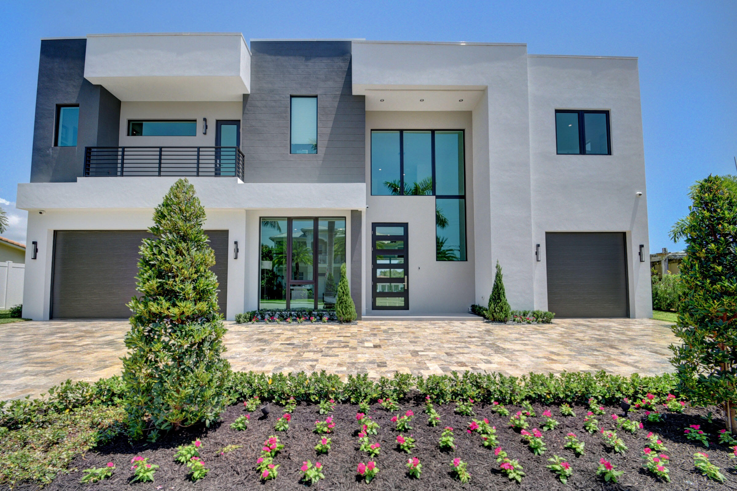 Live A Boater's Dream Lifestyle in this Newly Constructed and Move-In Ready Luxury Waterfront Estate! This 6 Bedroom 6.5 Bath home will capture your attention with exquisite finishes and beautifully back-lit high ceilings. Highlights include an elevator, wet bar, smart home system, and a gourmet kitchen with a cooking island & Thermador appliances! Enjoy calming waterway views throughout the home and relax on your resort style patio featuring a full summer kitchen and a large family pool with a sun shelf. This Boca no fixed bridge Deepwater estate has 82.5 ft. of seawall with a 50 ft. concrete dock along with a newly installed 20,000 lb aluminum boat lift.