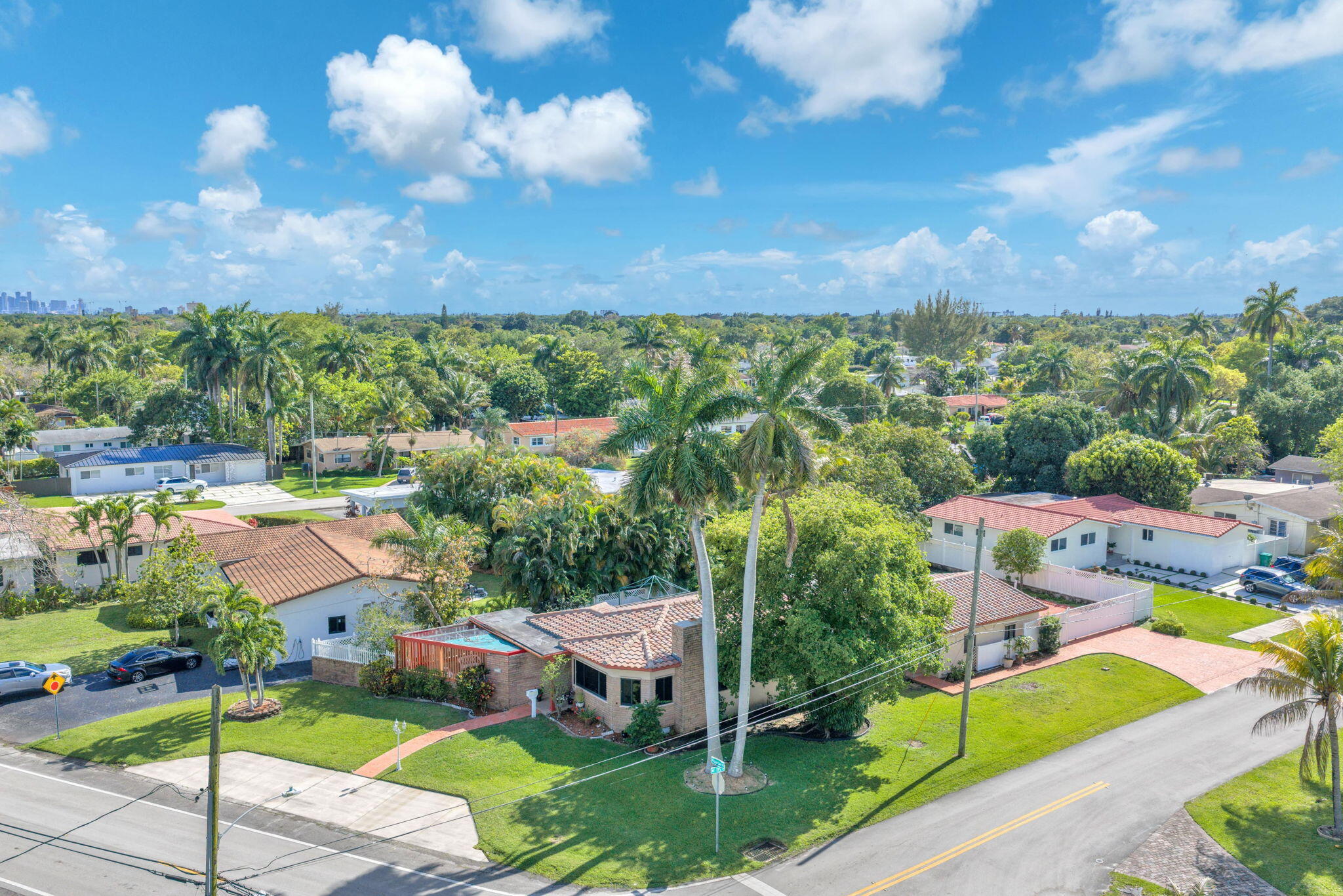Just shy of half an acre, this rare corner lot opportunity doesn't come around often!  The interior is completely dialed in with high-end finishes throughout. Features include impact windows and doors, recessed lighting, top-of-the-line stainless steel appliances, polished porcelain tile flooring, modern 5.5-inch baseboards, quartz kitchen countertops, custom cabinetry, and a sleek designer backsplash.  The bathrooms have been fully customized with premium finishes, offering a truly elevated feel.  The property also includes a private electric gate in the rear, providing secure space to park vehicles, boats, and/or RVs inside the property.  Conveniently located just 16 minutes from Miami International Airport and 19 minutes from Downtown Miami. Just shy of half an acre, this rare corner lot opportunity doesn't come around often!  The interior is completely dialed in with high-end finishes throughout. Features include impact windows and doors, recessed lighting, top-of-the-line stainless steel appliances, polished porcelain tile flooring, modern 5.5-inch baseboards, quartz kitchen countertops, custom cabinetry, and a sleek designer backsplash.  The bathrooms have been fully customized with premium finishes, offering a truly elevated feel.  The property also includes a private electric gate in the rear, providing secure space to park vehicles, boats, and/or RVs inside the property.  Conveniently located just 16 minutes from Miami International Airport and 19 minutes from Downtown Miami.