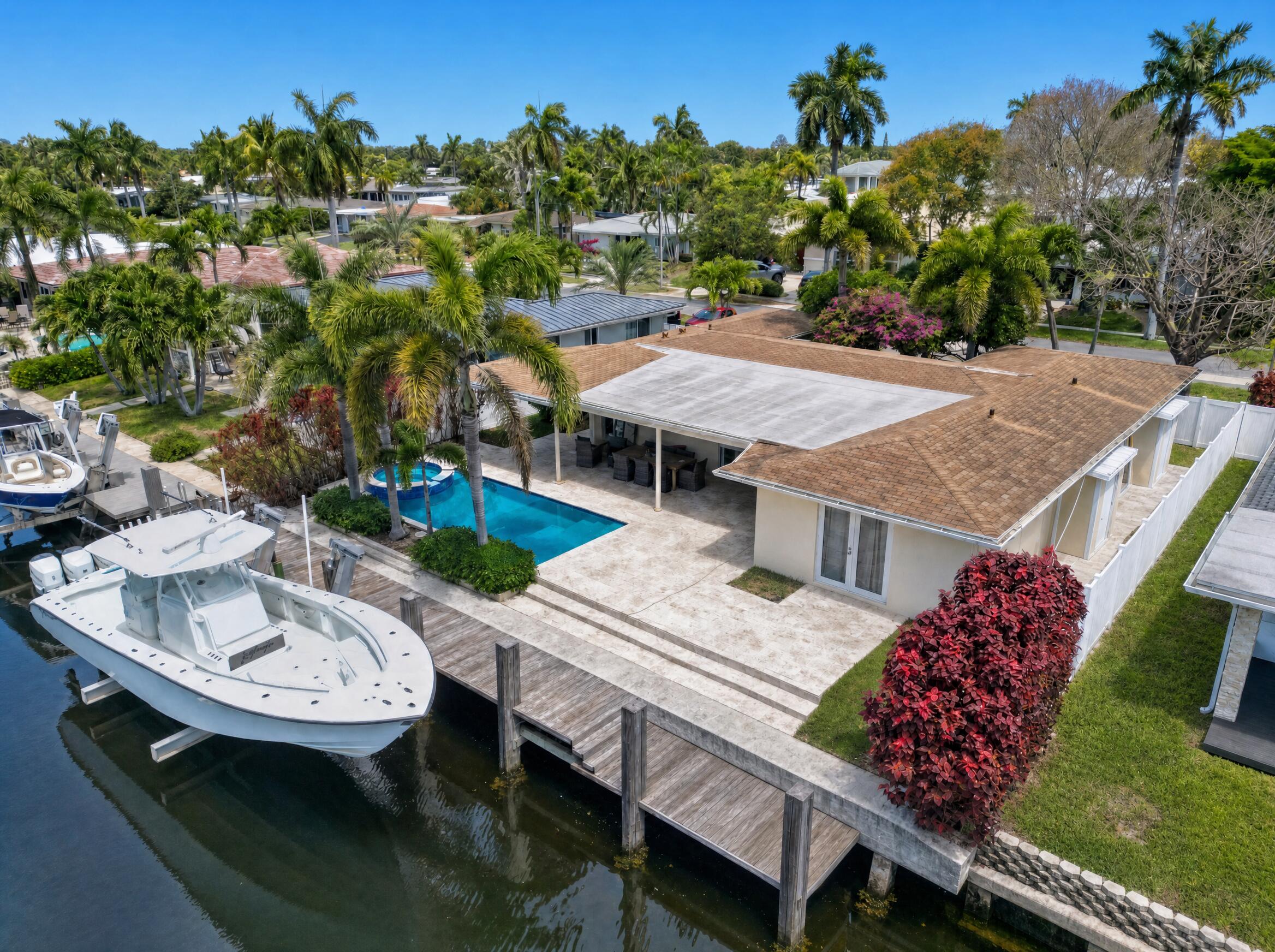Welcome to this beautifully renovated coastal retreat in the heart of Pompano Beach, where luxury waterfront living meets South Florida charm. Perfectly positioned on 70 feet of waterfront, this light-filled residence offers a serene coastal chic aesthetic with an open-concept floorplan designed for both relaxed living and entertaining. Fully updated with impact windows throughout. Plantation shutters add timeless elegance, while expansive living spaces overlook the sparkling waterway, private saltwater pool, and spa. Boating enthusiasts will appreciate the private dock and boat lift, offering direct access to South Florida's renowned waterways. Outside, enjoy a tranquil backyard oasis complete with tropical landscaping, covered lounging areas, and breathtaking waterfront views. Ideally located in one of Pompano Beach's premier family-friendly waterfront communities, the property is just minutes from both the newly revitalized downtown and the iconic Pompano Beach Pier, as well as the vibrant Deerfield Beach International Fishing Pier — approximately 7 minutes in either direction. Enjoy convenient access to the upscale dining, shopping, and entertainment of Boca Raton and Delray Beach to the north, with Fort Lauderdale just to the south. Centrally situated between both Fort Lauderdale-Hollywood International Airport and Palm Beach International Airport, this location offers exceptional convenience for full-time residents and seasonal owners alike. A rare opportunity to own a move-in ready waterfront sanctuary in one of South Florida's most desirable coastal locations.    There will be a quick showing 6/4 @ 2pm, only if you have any interested buyers. We do not want to disturb our tenant, so please only come if your buyer is cash or fully DU. Please take off your shoes when you arrive. Booties to be provided. Zone AE - Flood insurance rate zone that corresponds with flood depths greater than 3 feet. Mandatory flood insurance purchase requirements apply. Reach out to Amanda for SHOWING AND PROPERTY RELATED QUESTIONS. ROOF IS 2005. POOL/SPA SALTWATER. SEAWALL IN GREAT CONDITION. NATURAL GAS. LIFT DOES NOT CONVEY. APPRAISAL CAME IN OVER LISTED. STRONG BUYERS/OFFERS  ONLY. MAY PROVIDE APPRAISAL AND INSPCETION/WIND MIT/4 POINT/WDO BY REQUEST.