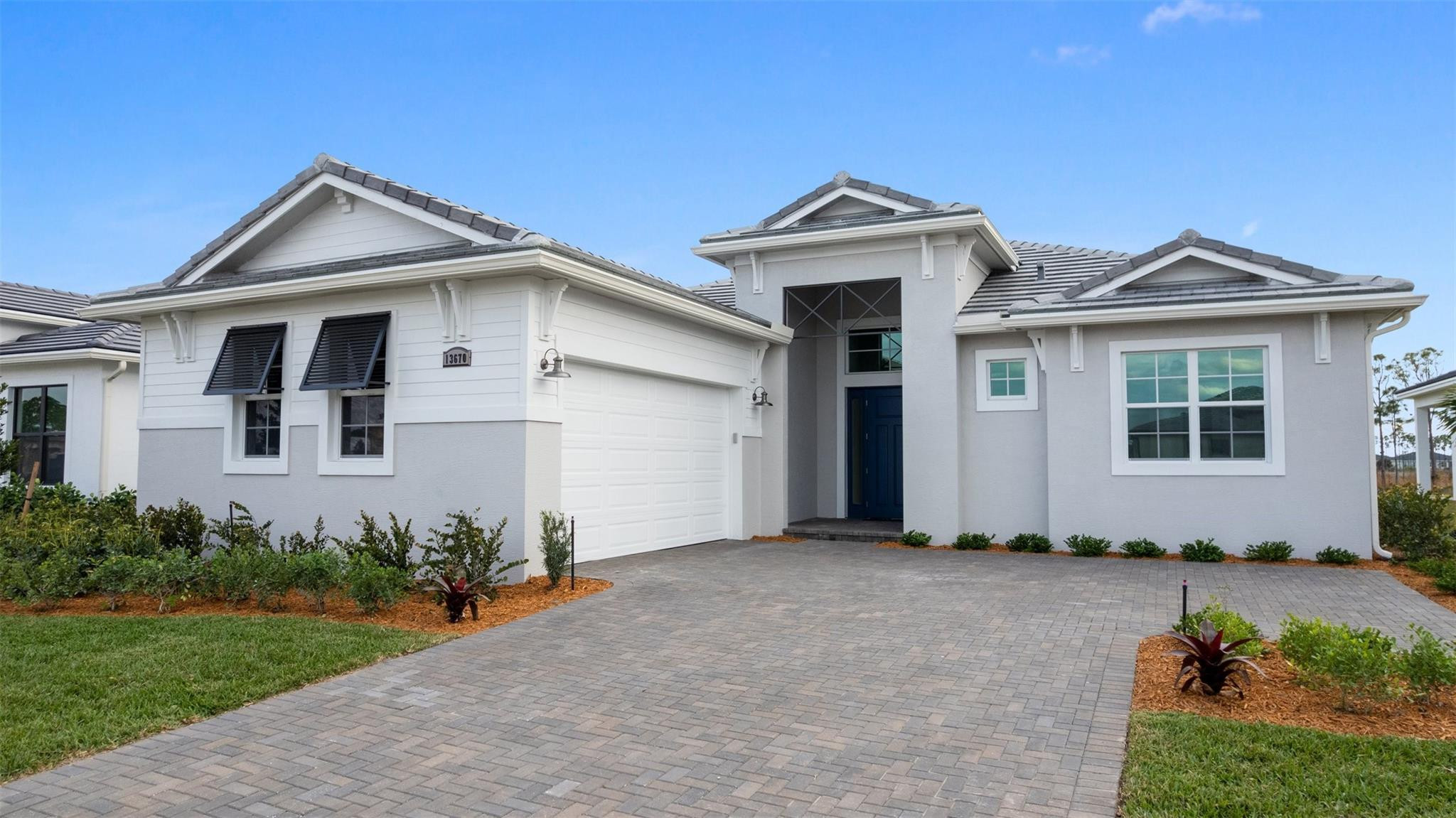 Move In Ready! Located in a Cul-de-sac homesite, this Riley floorplan features 3 Bedrooms, 3 Full and 1 Half Bath, Family Room with Corner Slider Option, Flex Room, Covered Lanai and 2-Car Garage. Additional features are gourmet kitchen configuration with an upgraded hood, Quartz Countertops, and 42” Upgraded Cabinets with Crown Moulding in Nordic Color. Mosaic residents have access to resort story amenities, including the pool, fitness center and pickleball, all minutes form I-95, dining, and shopping.