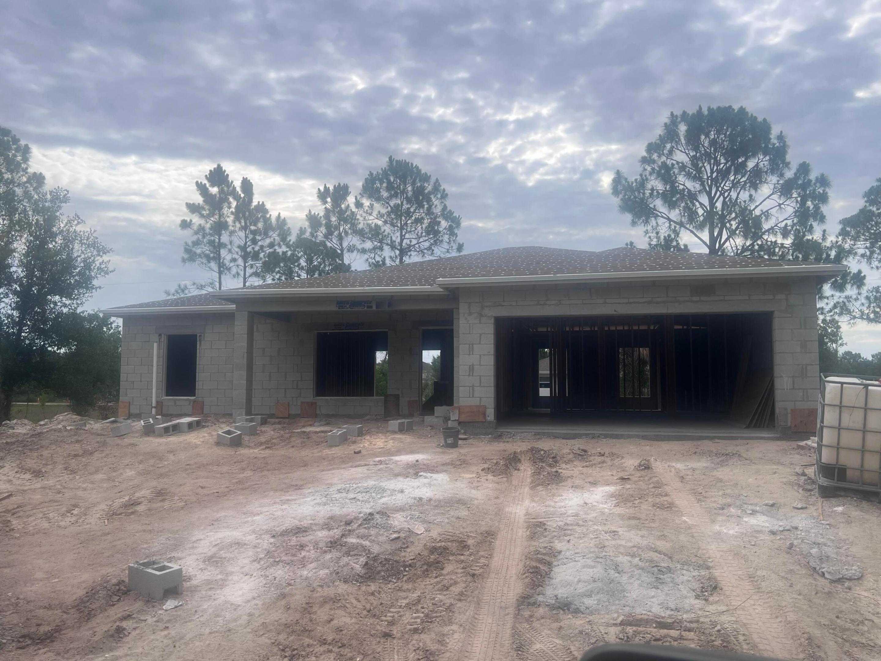 Projected completion date is 9/1/2026. NEW COSNTRUCTION Ready to move in!! Very well appointed 3 Bedroom 2 Bath 2 Car Garage home located in the Basswood Estates area of Okeechobee. This property is located on over Â¼ acre coming in at .358 acres. This is a CBS home designed above the minimum requirements of Okeechobee and boasts compliance more like coastal communities of a 170 MPH wind zones. The home will have the most recent versions of Rheems' Heat Pump HVAC system specifically designed based on the homes' energy consumptions. IMPACT RESISTANT WINDOWS / FRONT DOOR / GARAGE DOOR are included with this home. No Builder GRADE items here. All wood cabinets, quartz countertops, Moen plumbing fixtures, Kilcher Lighting, Sherwin-Williams paint, tile throughout, full gutters.  So Much More See Documents for the floor plans