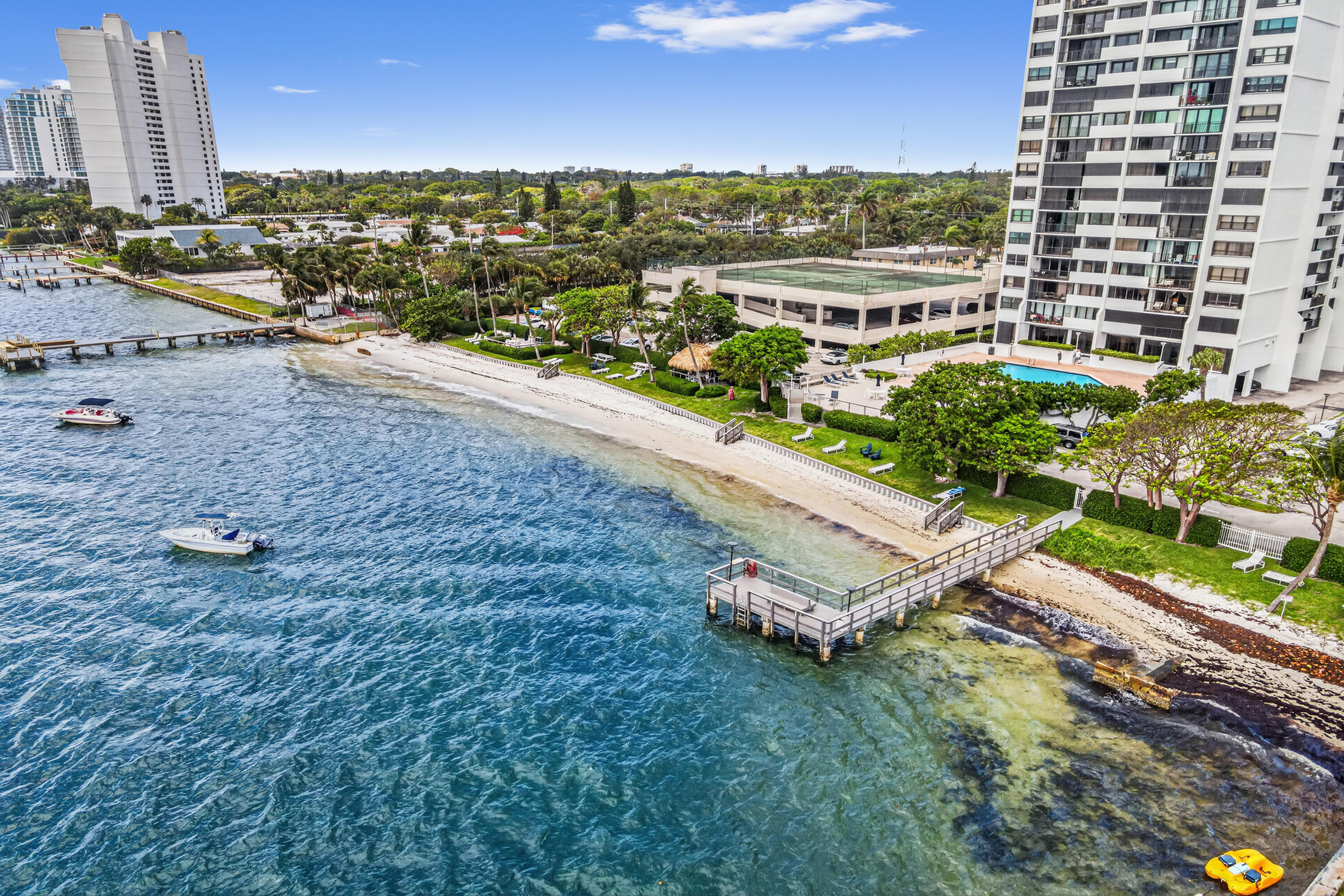 Experience coastal luxury in this gated condo at Palm Beach House Condominiums. Situated on the 11th floor of a 28-story building, this beautifully maintained residence offers breathtaking Ocean and Intracoastal views with 917 sq ft of living space, featuring 1 bedroom and 1.5 bathrooms. The unit welcomes you with a foyer entry leading into the spacious dining and living areas filled with natural light.   The kitchen is equipped with granite countertops, stainless steel appliances, ample cabinetry, and modern finishes perfect for everyday living and entertaining. Enjoy the covered/open balcony where you can relax and take in the stunning water views. This condo also includes 2 assigned parking spaces for added convenience.  Residents enjoy resort-style amenities including a private beach, fishing, kayaking, paddle boarding, commercial outdoor grilling stations, fitness room, game and event rooms, sauna rooms, and multiple social clubs. Rare opportunity to own a waterfront lifestyle with amenities you will not find under $1M.