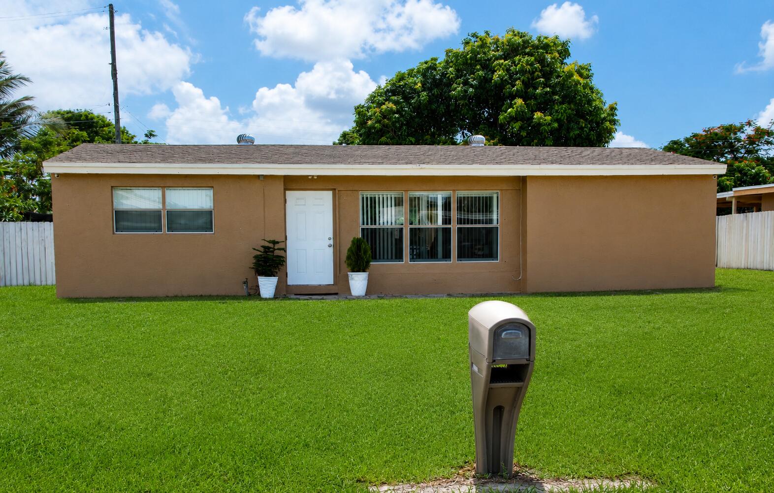 Beautifully renovated single-family home offering comfort, style, and functionality! This move-in ready residence features a bright open floor plan with abundant natural light, updated flooring throughout, a modern kitchen with white shaker cabinets, quartz countertops, stainless steel appliances, and stylish finishes. The spacious bedrooms and renovated bathrooms provide a clean, contemporary feel. Enjoy a large fenced backyard with plenty of room for entertaining, family gatherings, pets, or even adding a pool. Conveniently located near major highways, shopping, restaurants, schools, parks, and just a short drive to beaches and Palm Beach International Airport. No HOA! A fantastic opportunity for first-time homebuyers, families, or investors. Schedule your private showing today! Beautifully renovated single-family home offering comfort, style, and functionality! This move-in ready residence features a bright open floor plan with abundant natural light, updated flooring throughout, a modern kitchen with white shaker cabinets, quartz countertops, stainless steel appliances, and stylish finishes. The spacious bedrooms and renovated bathrooms provide a clean, contemporary feel. Enjoy a large fenced backyard with plenty of room for entertaining, family gatherings, pets, or even adding a pool. Conveniently located near major highways, shopping, restaurants, schools, parks, and just a short drive to beaches and Palm Beach International Airport. No HOA! A fantastic opportunity for first-time homebuyers, families, or investors.