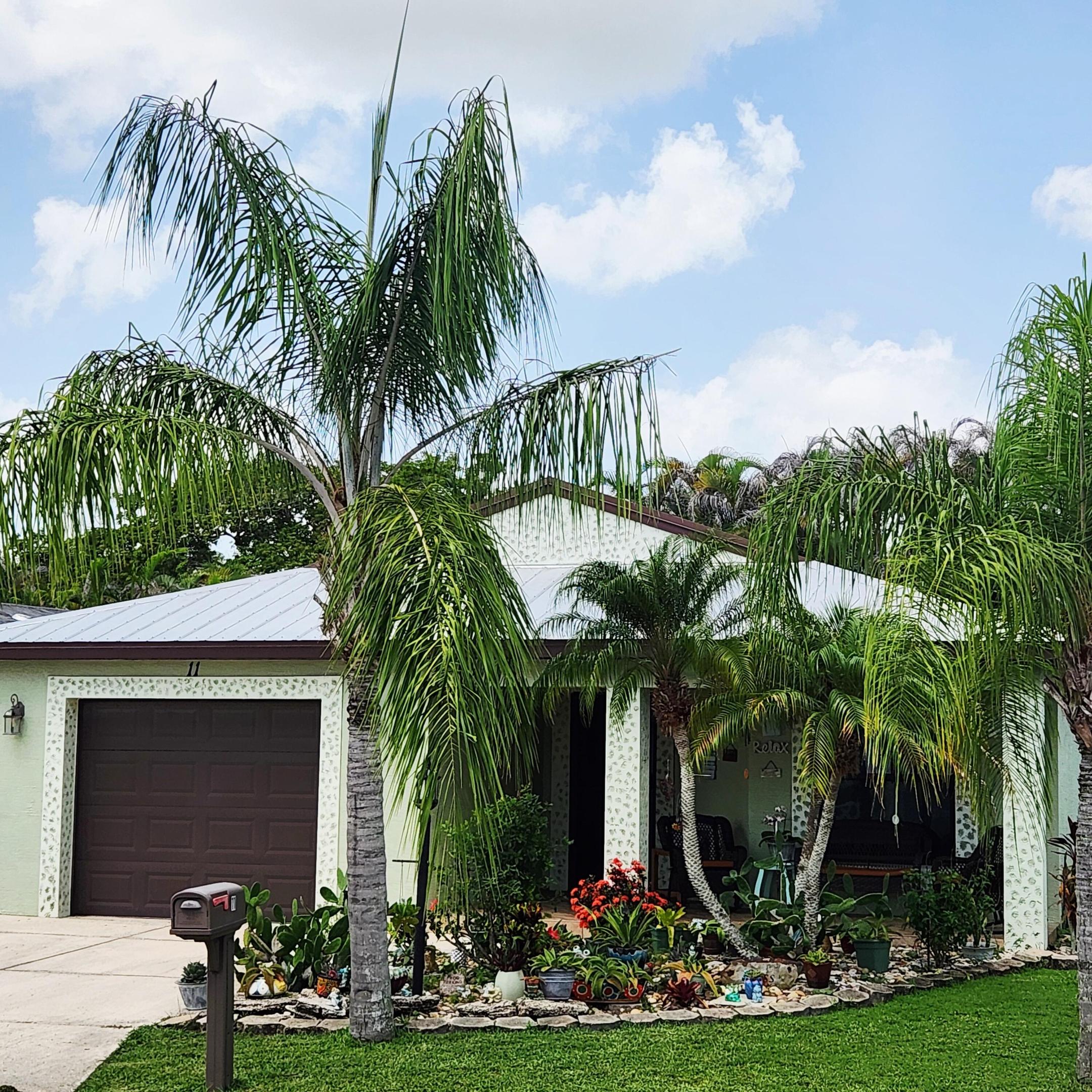 Find ELEGANCE,DURABILITY, SAFETY&AFFORDABILITY in this 2018 2bed/2bath home - BUILT toLAST - ConcreteBlock Construction w/ Metal Roof over Plywood for max strength. CustomLandscaping w/Roller Canopy, OutdoorWaterTank, Potted Plants & GOLFCART Remain! Step inside & beauty continues, 3 TVs stay, Int.Painted, New Lam.Flooring & BedRm Carpet,KeyPad Entry,OpenConcept,Vaulted Ceiling,GRANITECounters, StainlessSteel Appl. Master Bedrm w/ walk-in closet & en-suite bathrm w/ DualSinks. Barn Door to LANAI w/ AC. PRIMELOCATION;nearBeach (NOFLOODZONE),shopping, mall,grocery,restaurants, bank,hospital,postal &more! Lot Lease1062.79 includes trash, lawn,Clubhouse w/Activities, PrivateFREEGolf Course,HeatedPool,Spa,Fitness,Pickleball,Tennis,Shuffleboard Bocce,Library,Bingo,Parades, MahJong,Workshop&more!