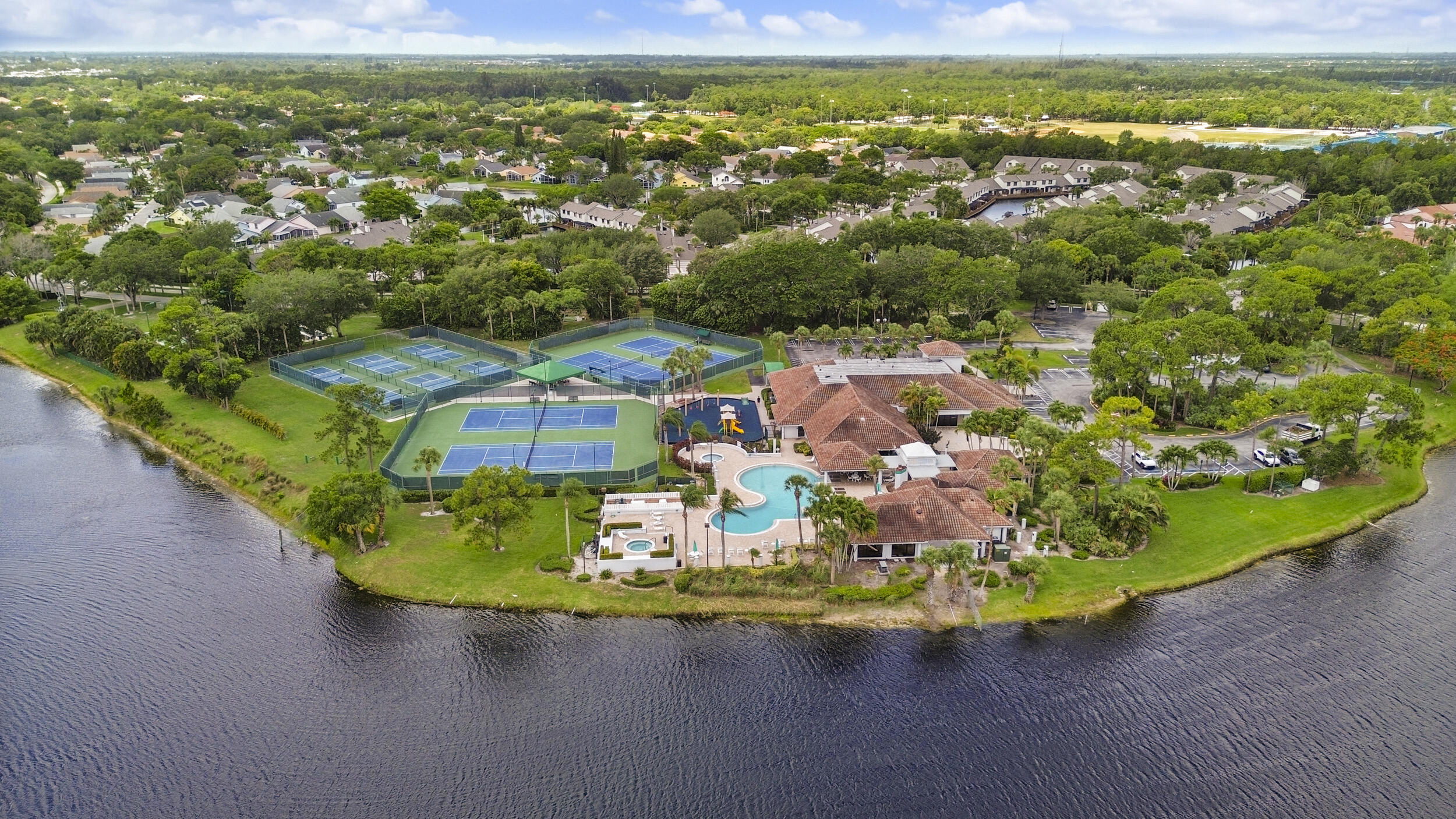 Full price offer = $10,000 credit to Buyer.  Ask for details.  3 Bedroom, 2 Bath Single Family Home in River Bridge; a Gated Community with all the Amenities and a LOW HOA Fee: Clubhouse, Pool, Spa, Tennis, Pickleball, Basketball, Playground, and Sidewalks lined with Mature Oak Trees. Currently used as a 2/2 plus Den, this home has undergone an amazing Kitchen Remodel, including White Wood Soft Close Cabinets, 42'' Uppers, Stainless Steel Appliances and Granite Tops with a Large Island and Bar Seating, completed in late 2023, along with Interior Paint, New Ceiling Fans and New Door Hardware throughout. The home has Cathedral Ceilings, Tile Throughout, Recessed Lighting, a Glass Enclosed Florida Room and a 2 Car Garage. Pets are Welcome.