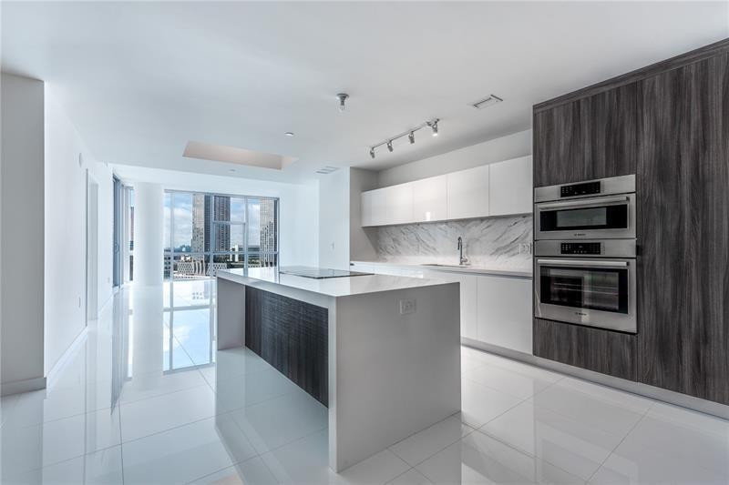 Welcome to this 19th floor corner unit boasting bay views and downtown city views!  This corner unit has 3 bedrooms + den, 4 full bathrooms and 2 balconies.  Easily Convert the den into a 4th bedroom with an ensuite bathroom and full size closet.  This floor plan is one of the largest in the building with views from each bedroom.  Owner has just installed blackout electronic blinds throughout as well as closet build-outs.