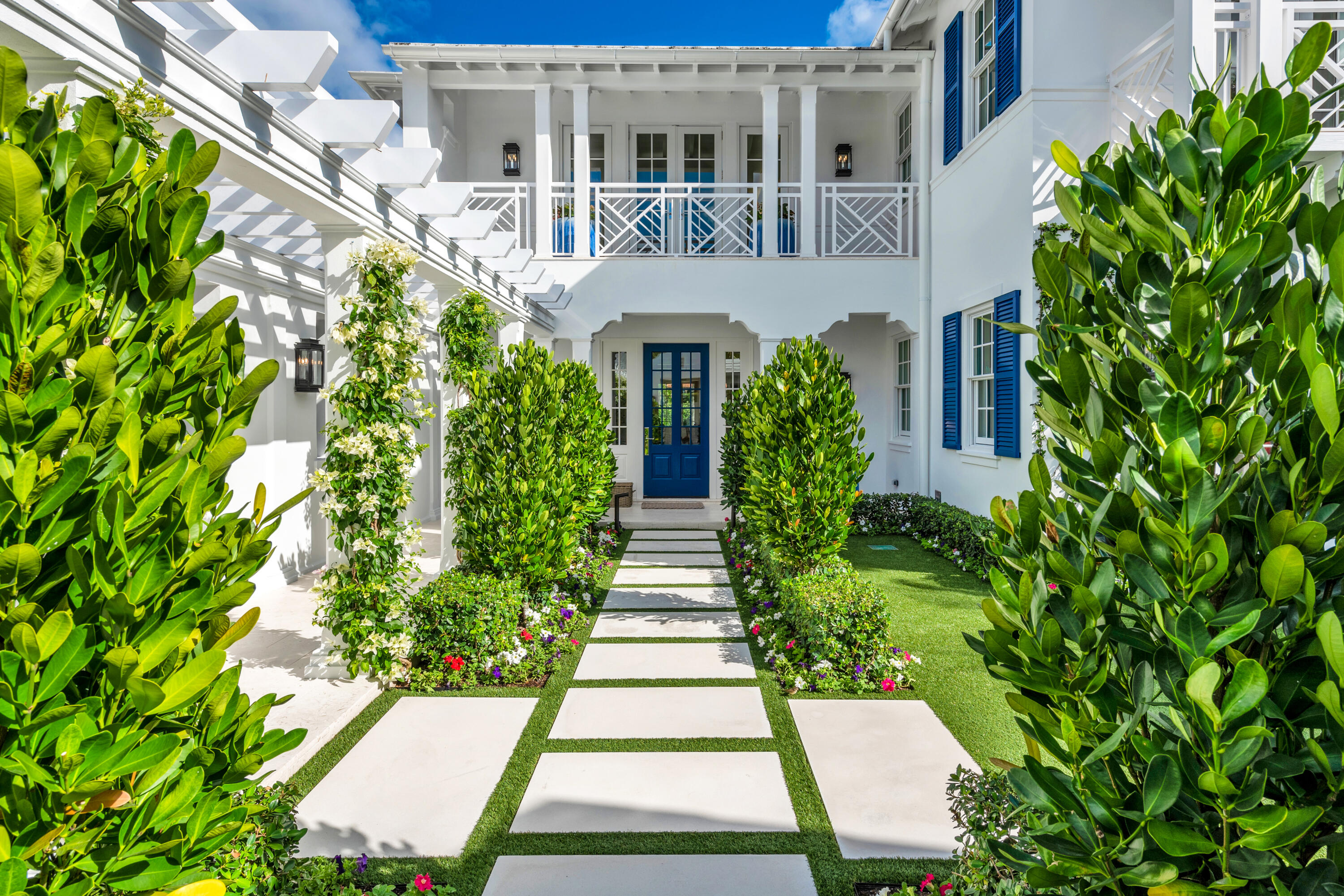 Stunning ''nearly new'' waterfront residence, complete with private dock centrally located on desirable Everglades Island. Offered completely furnished by noted designer Scott Snyder makes this a wonderful opportunity to begin your Palm Beach lifestyle. Every custom detail can be seen throughout this residence from the grand staircase, gracious living room, dining room, den, gourmet kitchen, family room with vaulted ceiling, to the outdoor loggia with fireplace that leads out to the manicured pool area. Two bedrooms with baths ensuite, powder room and private elevator complete the main level. The second level includes a bedroom with bath en-suite, an amazing Master Suite, with sitting area, two baths en-suite, luxurious closets & private terrace overlooking the water and pool area. Separate Guest House. Three car air-conditioned garage. Full house generator.  Finishes to include venetian plaster walls, marble and hardwood floors. top of the line security system.  Glass enclosed wine room.