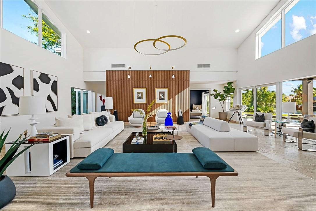 At this bespoke Coral Ridge waterfront estate, every detail is curated to make the most of every moment of each day. A privately gated home with two entrances, Bayview Drive and NE 24th Ct. Enjoy a west-facing courtyard, two verandas, a private dock with ocean access and no fixed bridges, a primary downstairs bedroom, a grand living room, and a chef’s kitchen that is carefully laid out in a floor plan that allows for large gatherings as well as intimate corners for a book or quiet contemplation. In pristine condition and with a backyard facing southeast offering long canal views, this four-bedroom residence has everything treasured by a discerning owner. This is the perfect private oasis in the Bayview school district, just minutes from Fort Lauderdale Beach and Las Olas Blvd.