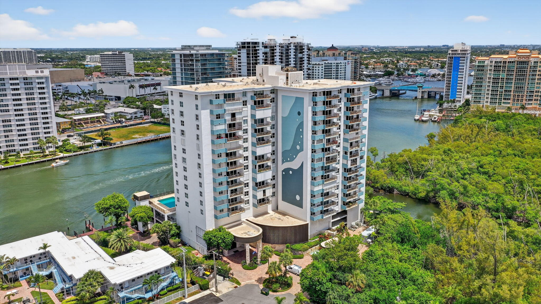Experience the pinnacle of luxury living in vibrant Fort Lauderdale! This stunning corner unit not only boasts an unbeatable location but also offers panoramic water views that will leave you breathless. Gaze out over the shimmering Intracoastal Waterway, the sparkling Atlantic Ocean, and the tranquil greenery of Bonnet State Park, all from the comfort of your home. For boating enthusiasts, dockage is available for vessels up to 35 feet on an annual rental basis, a rare and coveted amenity.
Inside, you'll find 3 generously sized bedrooms and 2.5 elegantly appointed baths, designed with both comfort and style in mind. The expansive living and dining area is tailor-made for relaxation or entertaining, while the open-concept eat-in kitchen is a chef's paradise. With a separate pantry and a corner window, this kitchen is as functional as it is beautiful. Throughout the home, new wood-look flooring adds a modern yet warm touch, while thoughtful details like a separate laundry room, ample storage, and impact glass ensure convenience and peace of mind. Step outside to a large private balcony that truly sets this property apart. Featuring custom bar seating, a perfect spot to sip your morning coffee or toast the sunset while soaking in those breathtaking views. 
This location offers the ultimate beach lifestyle, just three short blocks from the beach. Enjoy the convenience of walking to over 20 restaurants, bars, and shops, all within minutes. With several available boat docks and no fixed bridges, it's a boater's dream. Plus, you're just 15 minutes from the airport, making travel a breeze.
Whether you're seeking a serene retreat or an entertainer's dream, this property delivers on all fronts. Don't miss the chance to make this extraordinary home your own!