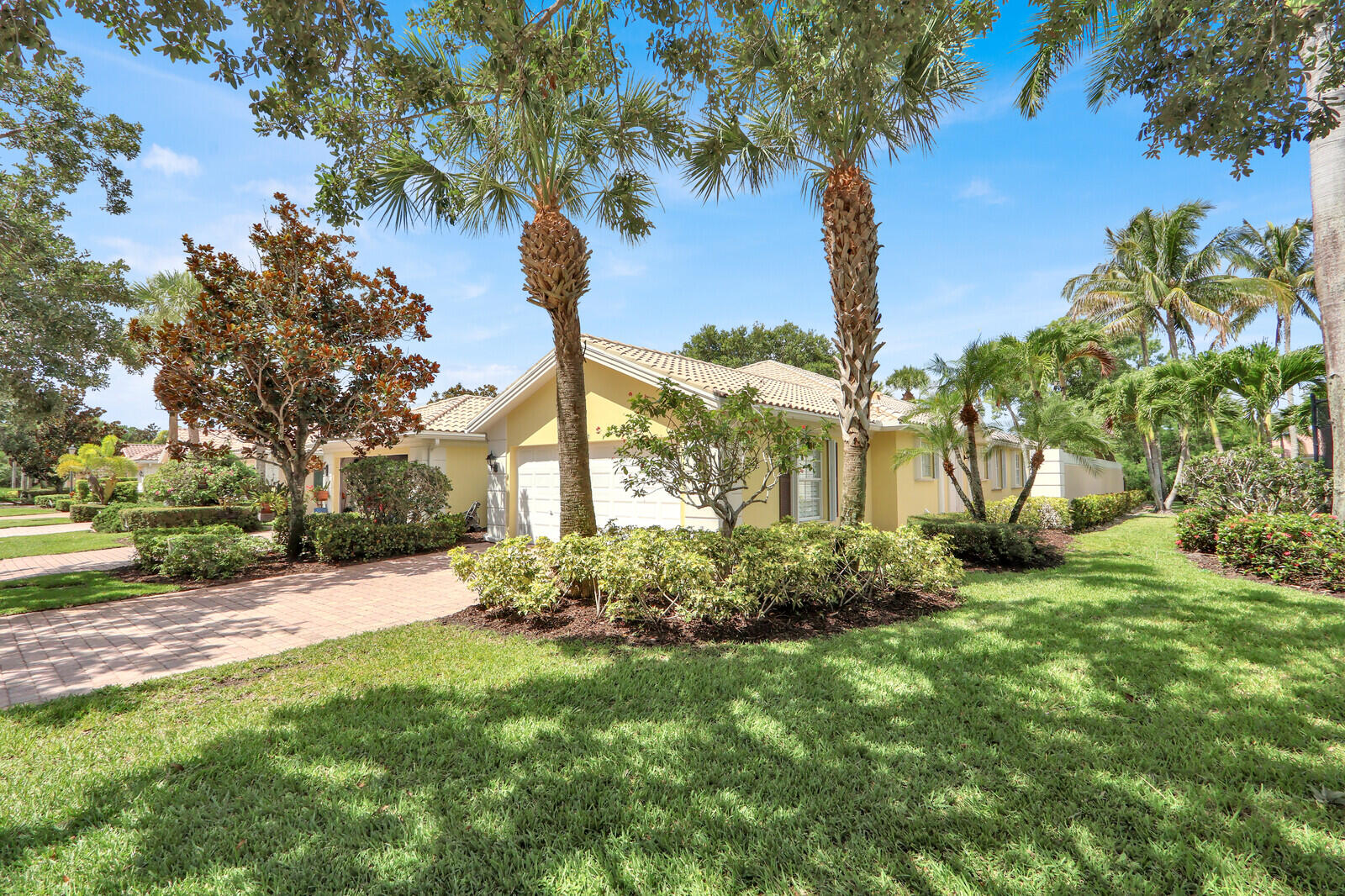 Impeccable 2 BR/ 2 BA / 2 car extended capri model on beautiful lake setting.  DiVosta tile throughout the entire split bedroom floor plan.  Walls have been freshly painted in Benjamin Moore, Chantilly Lace.  Large slat plantation shutters and crown molding throughout.  Impact sliding glass door in back with accordion shutters on all surrounding window openings.  This home is IMMACULATE and ready to go!!!